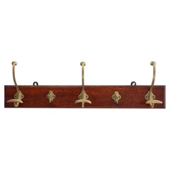 Art Nouveau coatrack in brass and oak, France ca. 1900