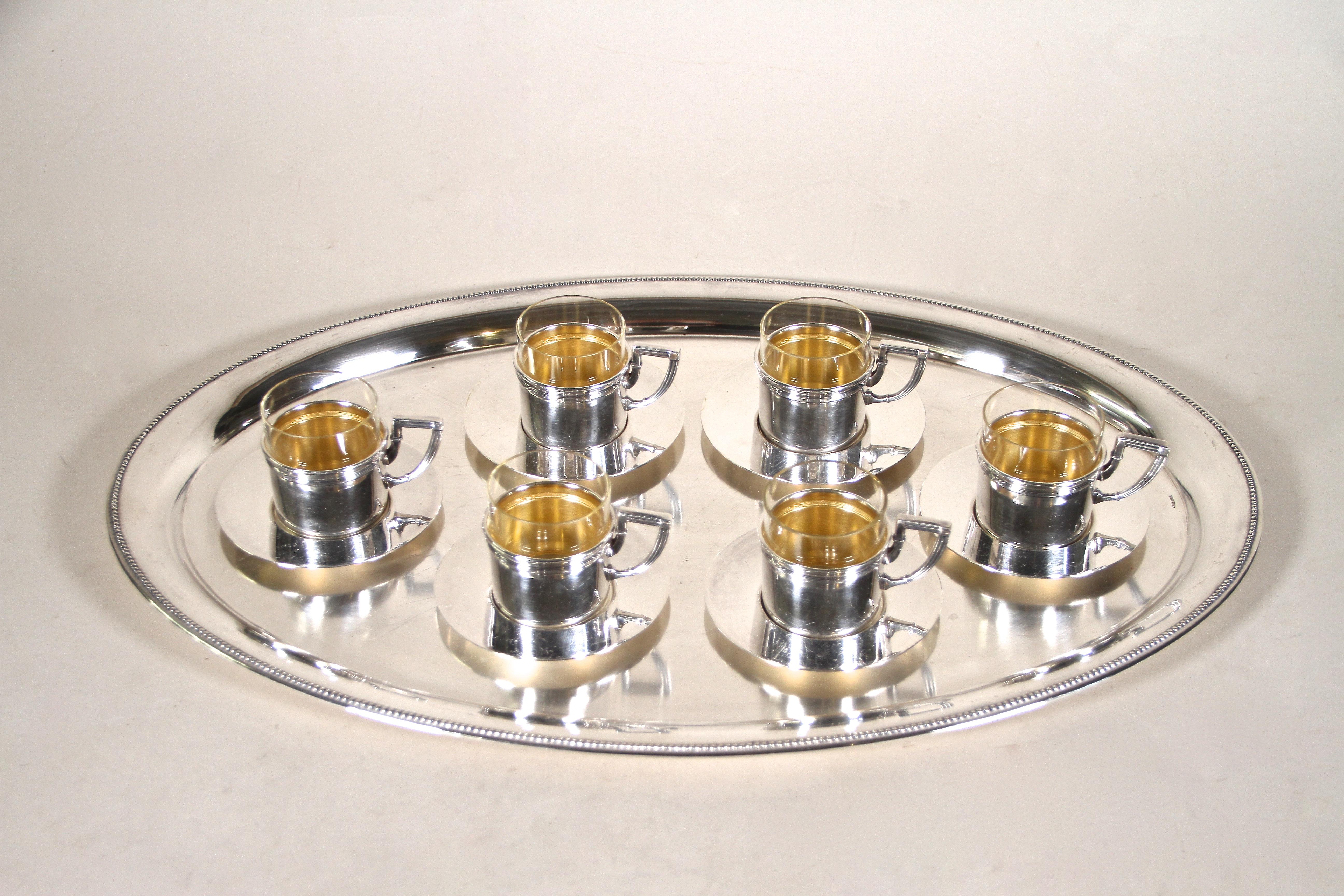 Delightful silvered Coffee service from the Art Nouveau era in Vienna/ Austria around 1910 made by the renown company of Argentor Vienna. This amazing coffee set consists of 6 beautiful designed espresso cups including 6 silvered saucers on an oval