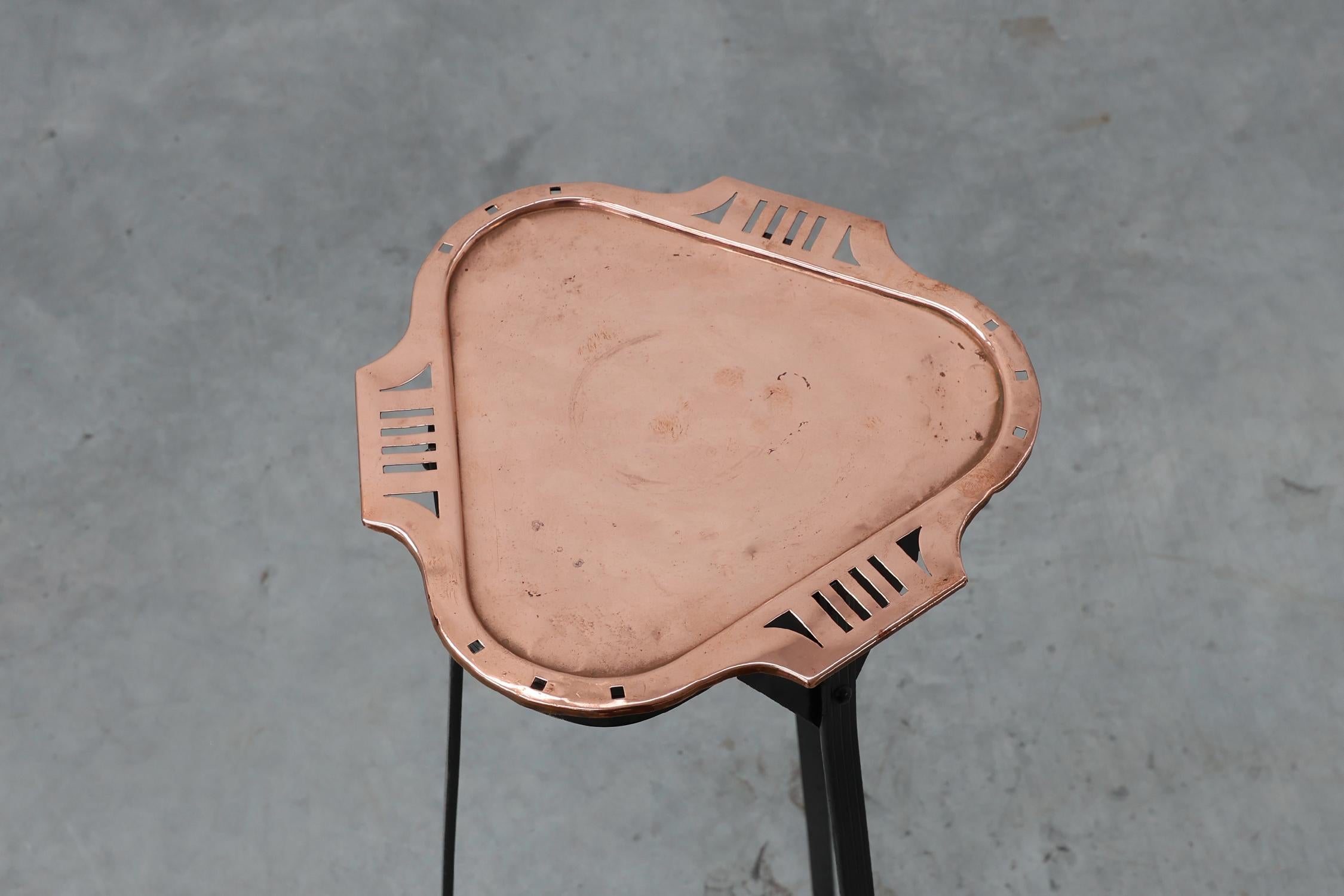 Belgium / 1915 / Console  / metal, copper / Art Deco / Art Nouveau / Jugendstil

Unique console in the manner of Belgian Art Deco designer Gustave Serrurier-Bovy, ca. 1915. This tall sleek console has a black cast iron tripod constructed base and a