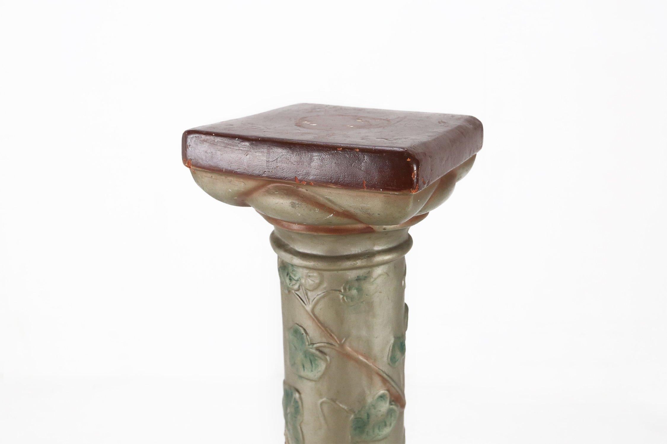 France / 1920 / console / plaster / Art Nouveau

A French console in glazed plaster with nice sculpture details and floral decorations of grapes growing along the pillar. Made in the 1920's in Art Nouveau style. With a square base and top. This
