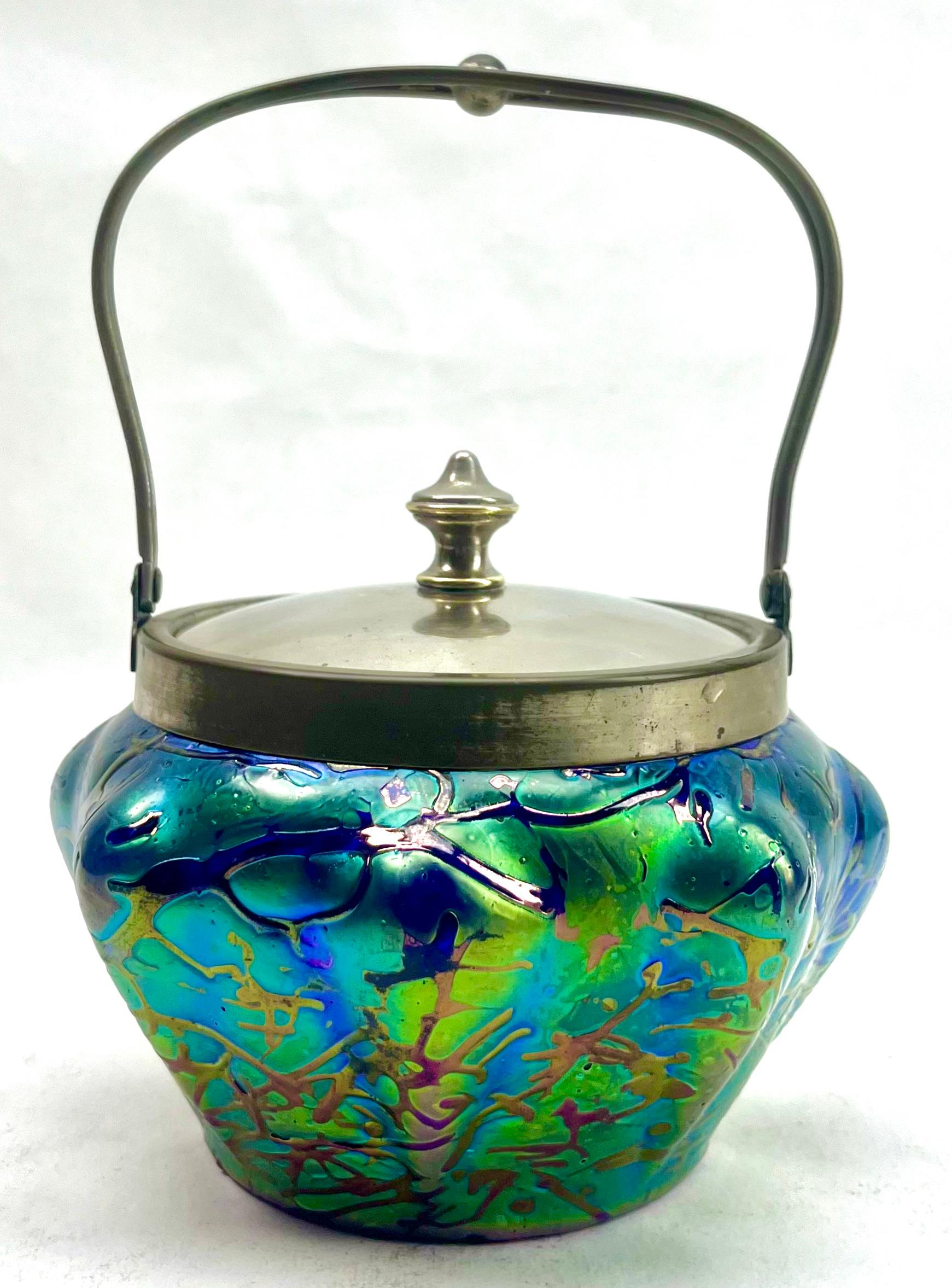 Art Nouveau Cookie jar iridescent glass by Loetz' with Lid

Subtle, hand blown glass vase in the Art Art Nouveau style. 

Special color and technique for any collector.
Looks simply stunning. 




   