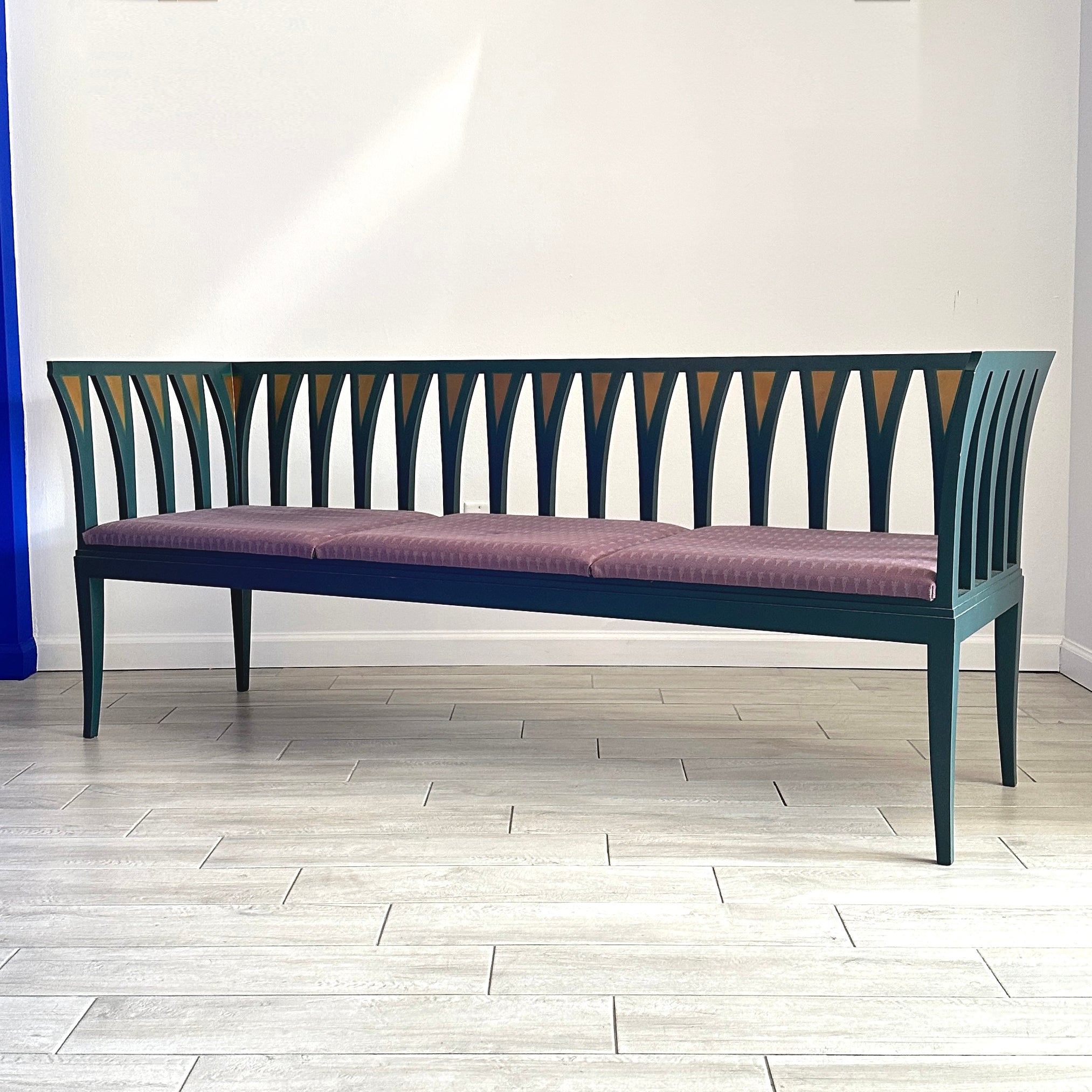 Painted solid birch bench designed by Finnish-American architect Eliel Saarinen for the study of his wife Loja at Cranbrook in 1929 and reissued by Adelta Oy circa 1987 in Finland. Pierced framework with geometric pattern in gold leaf and