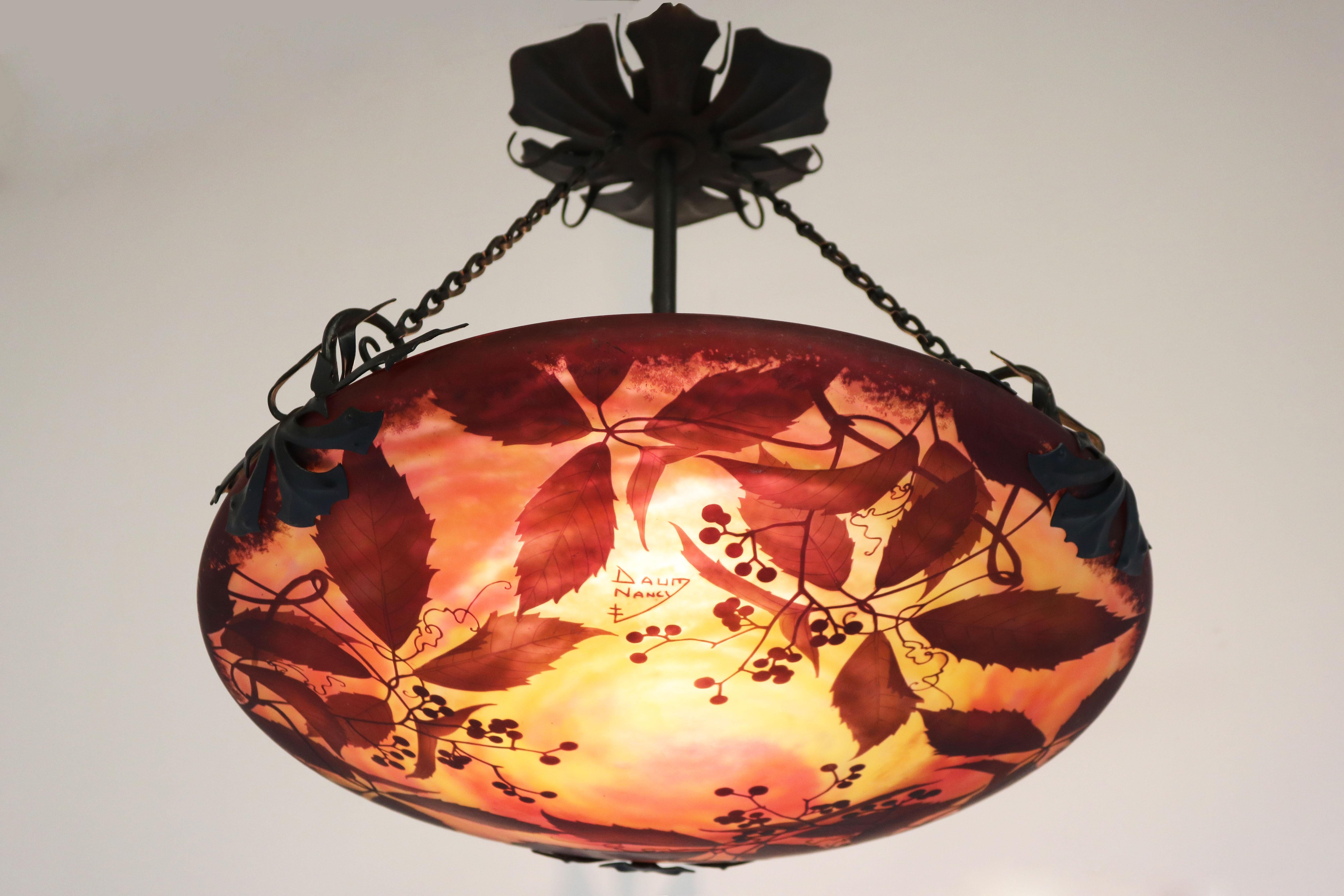 Exquisite & most impressive! This original French antique Daum Nancy Art Nouveau / Arts & crafts pendant light / chandelier. 
Breathtaking yellow orange red Cameo glass lamp shade with grape vines & vine leaves an exquisite display of Daum Nancys