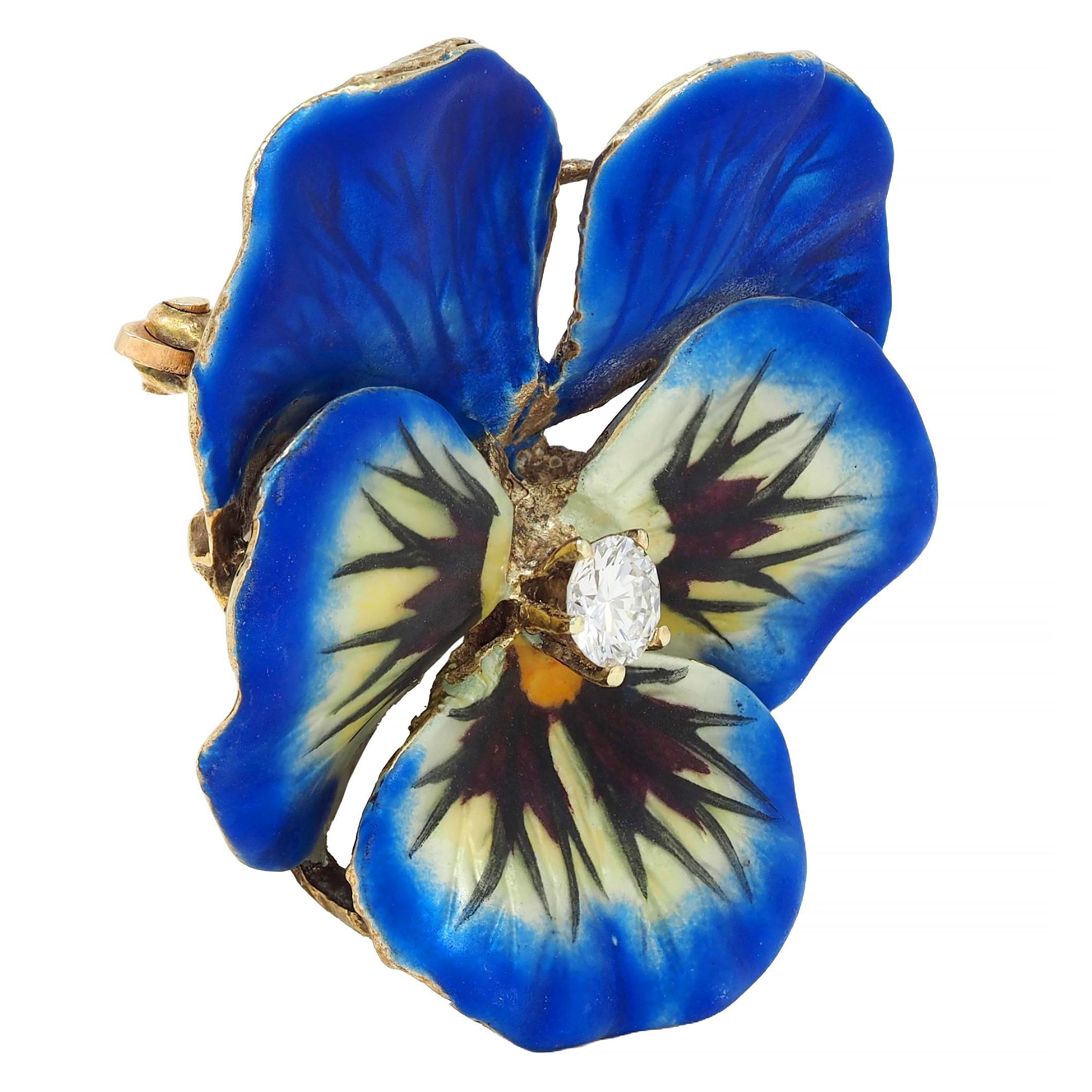 Designed as a dimensional pansy flower painted with basse-taille enamel
Transparent white, blue, and yellow glossed over linear engraving
Accented by painted opaque black and maroon enamel details
Exhibiting minimal loss and centering a transitional