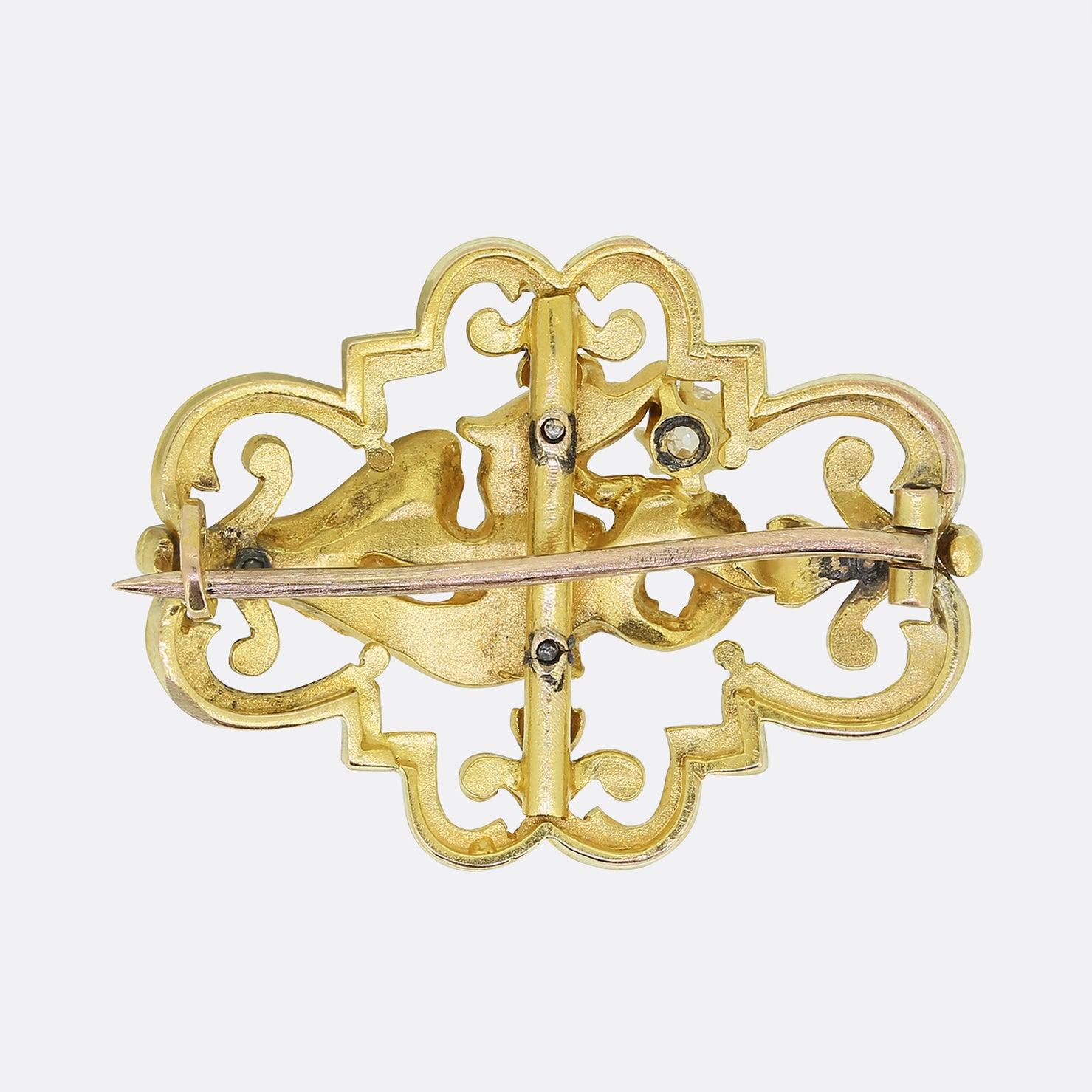 Here we have a fantastic antique brooch crafted from 22ct yellow gold at a time when the Art Nouveau style was at its pinnacle. An open framework with fleur-de-lis designs acts as the backdrop to the focal phoenix centre piece. The phoenix bears a