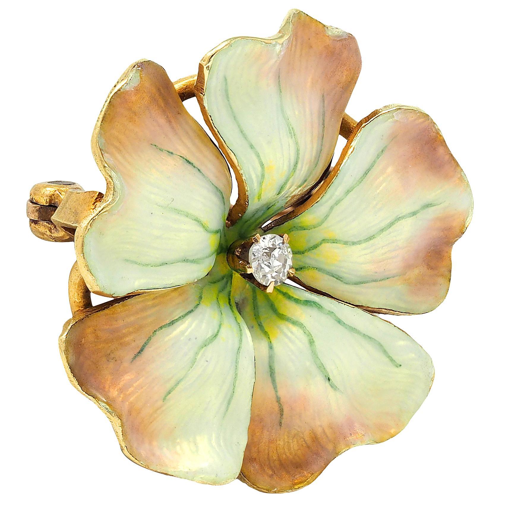 Designed as a dimensional gold flower with furling petals
Painted with basse-taille enamel over linear engraving
Transparent iridescent yellow to pink with blue veins
Enamel with minor loss at edges
Centering a prong set old European cut