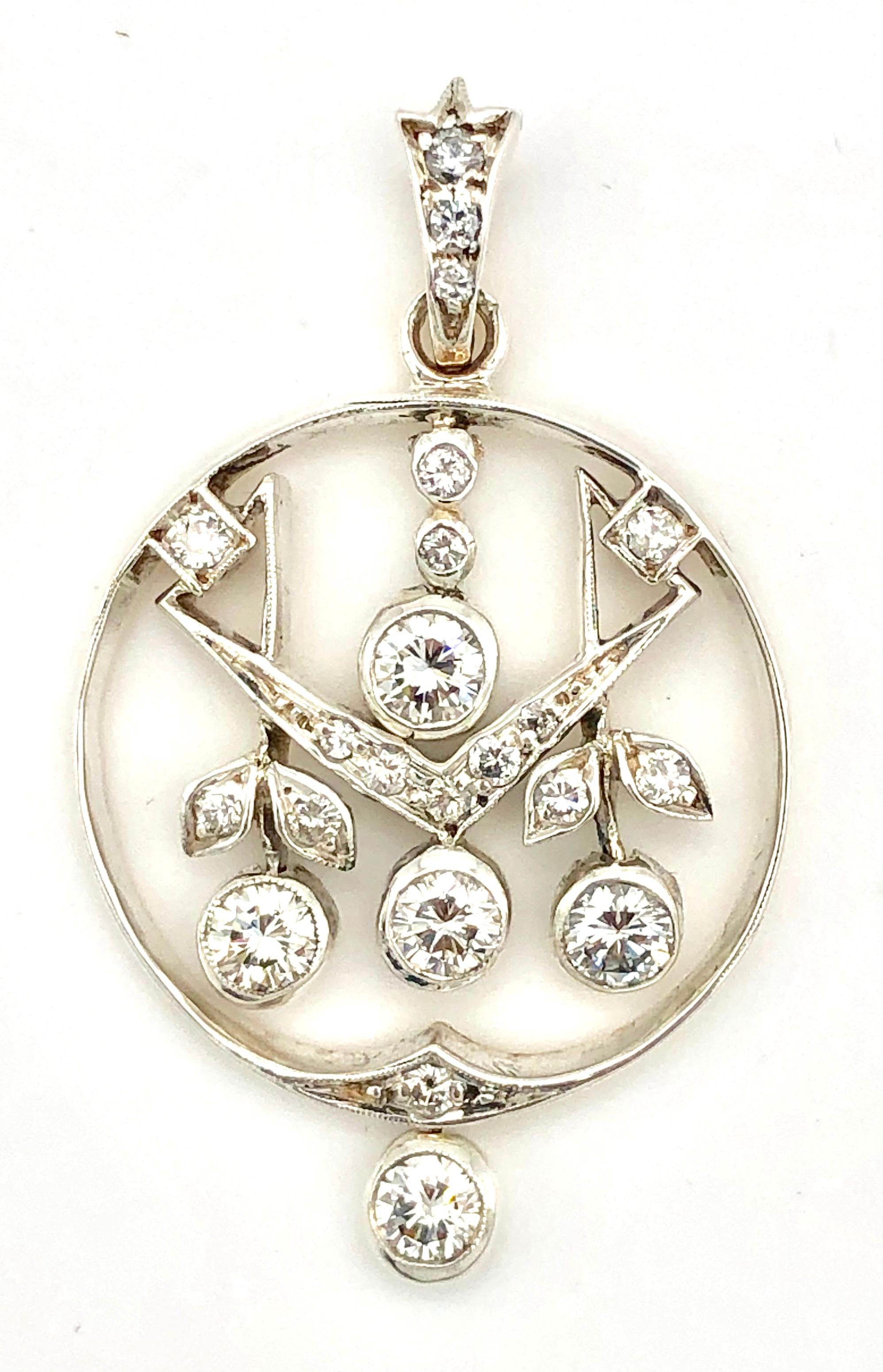 This very charming  Art Nouveau pendant has been made round about 1900 in Austria. Five articulated round diamonds are supended from a frame in the shape of an apple. Two of the dangling diamonds are designed as two little flower buds with diamond