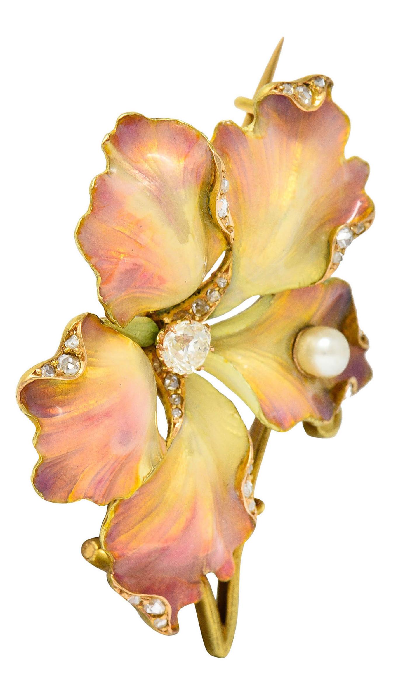Designed as a highly rendered five petaled flower

Glossed with translucent cream to pink ombre enamel - exhibiting very minor loss

Centering an old European cut diamond weighing approximately 0.20 carat - G color with SI2 clarity

Accented by rose