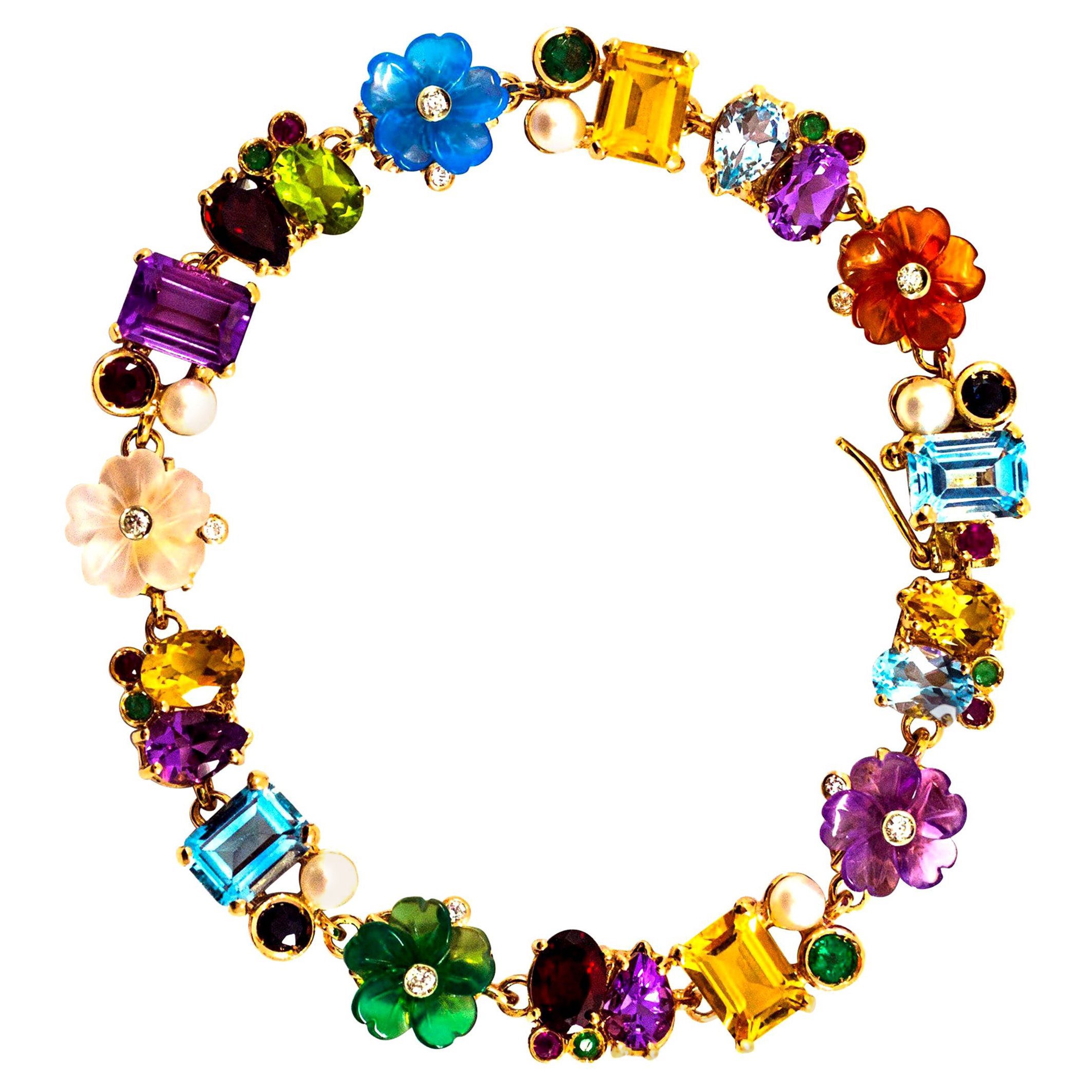 Bracciale Art Nouveau con diamanti, rubini, smeraldi, zaffiri, perle e fiori in oro giallo