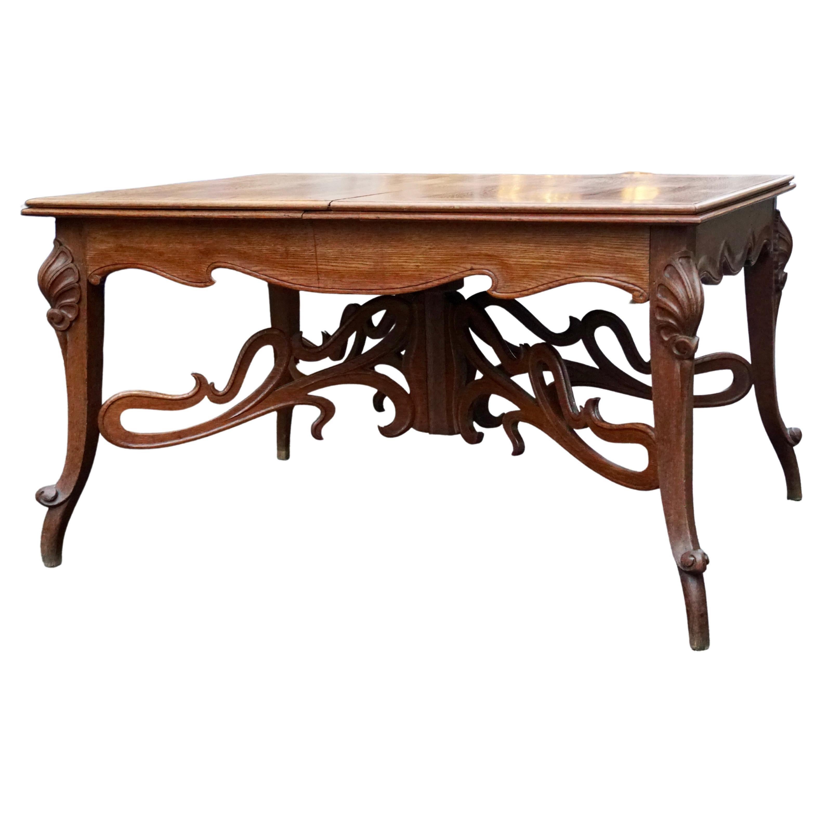 An Art Nouveau period extending dining table, France, circa 1890-1910. (with two conmforming leaves.)

The table can be extended to a length of 89