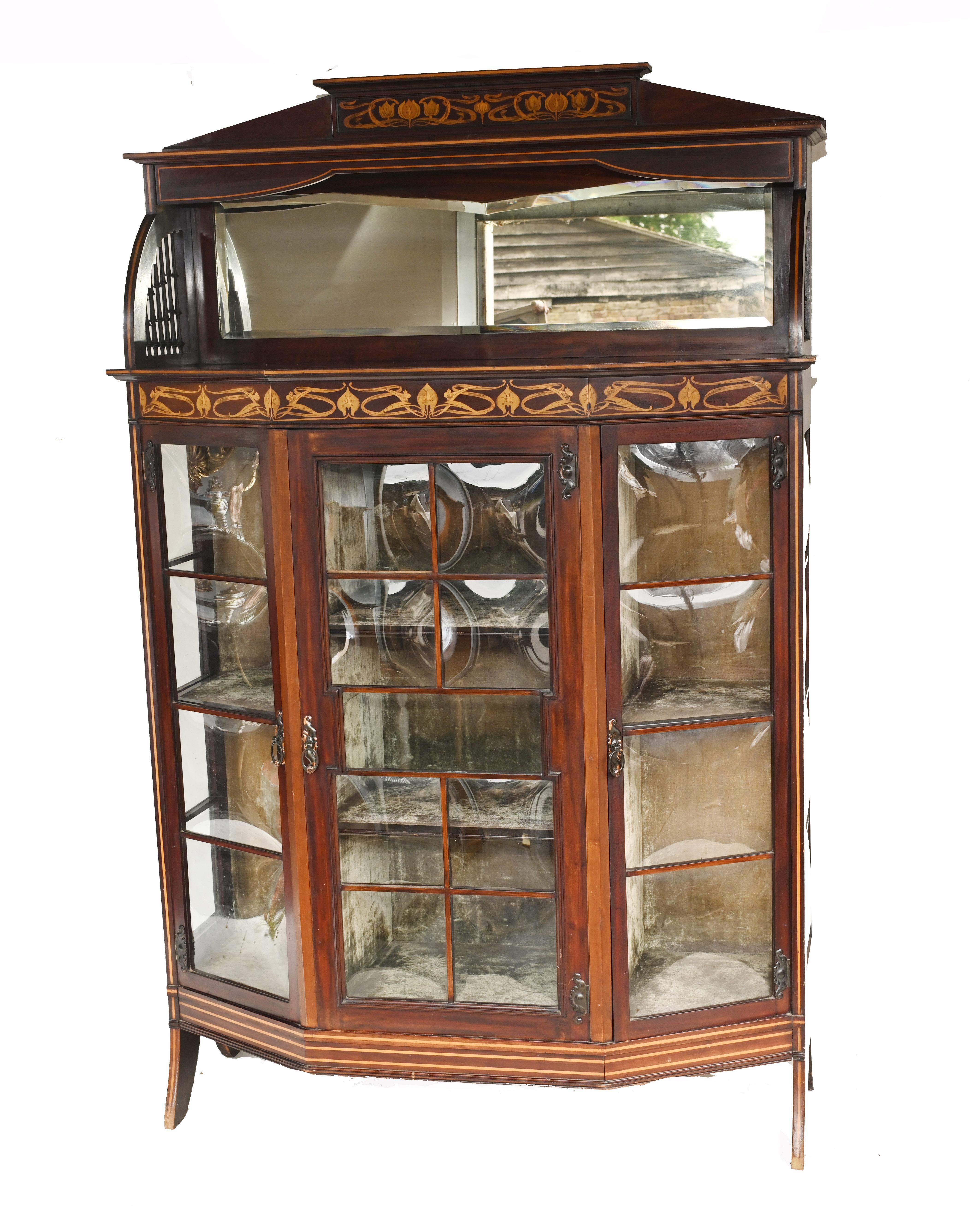 Curvy English art nouveau display cabinet
Made by Golding and Son out of Bolton (please see makers stamp)
The main thing that grabbed our attention was the curved glass
Classic inlay work showing floral motifs
We date this to circa 1900
Some of
