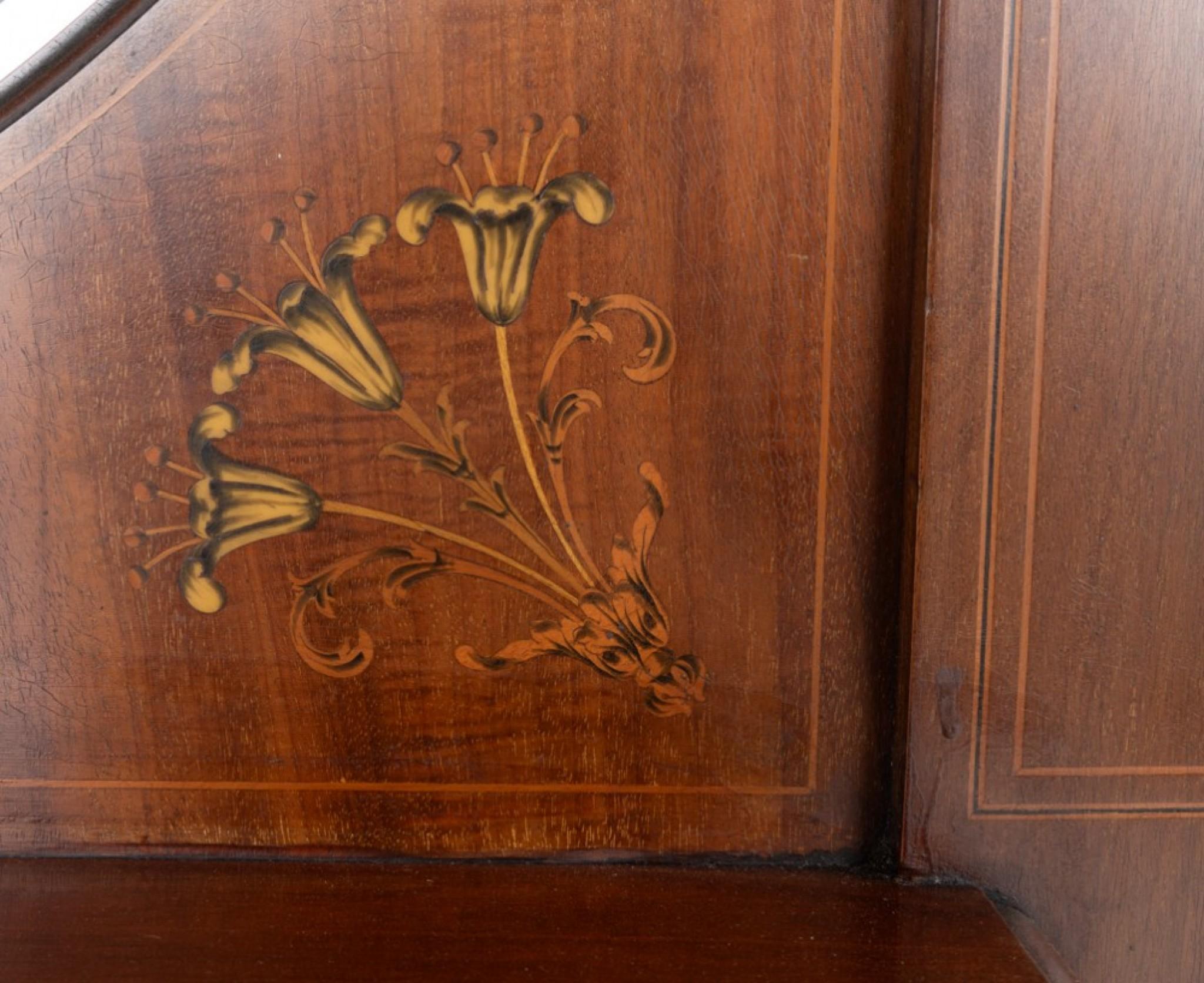 Impressive art nouveau mahogany display cabinet.
Circa 1890
This cabinet is raised upon cabriole legs with a shaped frieze.
The bow central door having lead work glass.
The upper section is supported by carved and fluted corinthian columns.
The