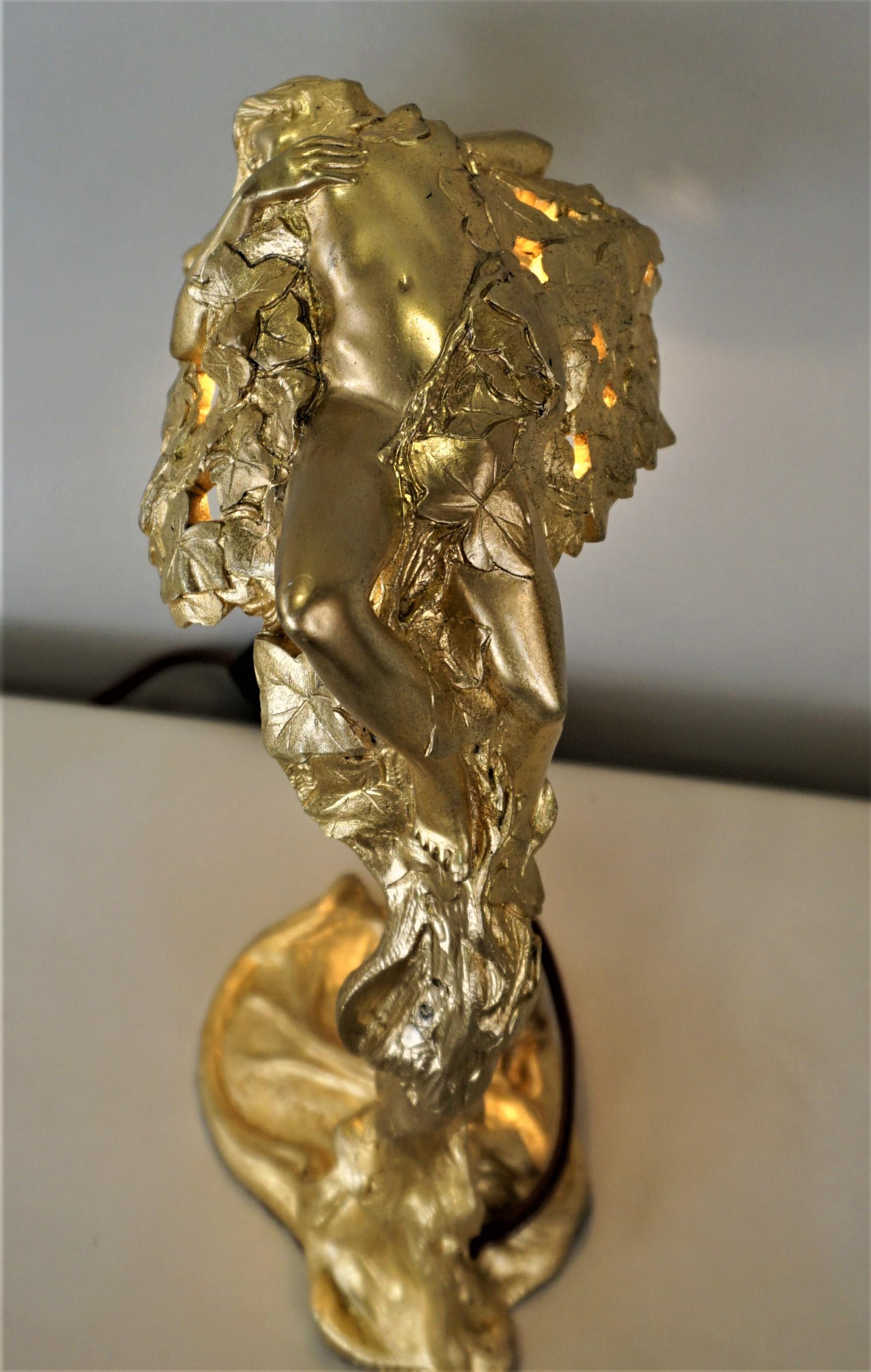Doré Art Nouveau bronze table lamp from 1902 design and created by Emil Thomasson. This design depicts how the nymph Daphne turns into a laurel tree.