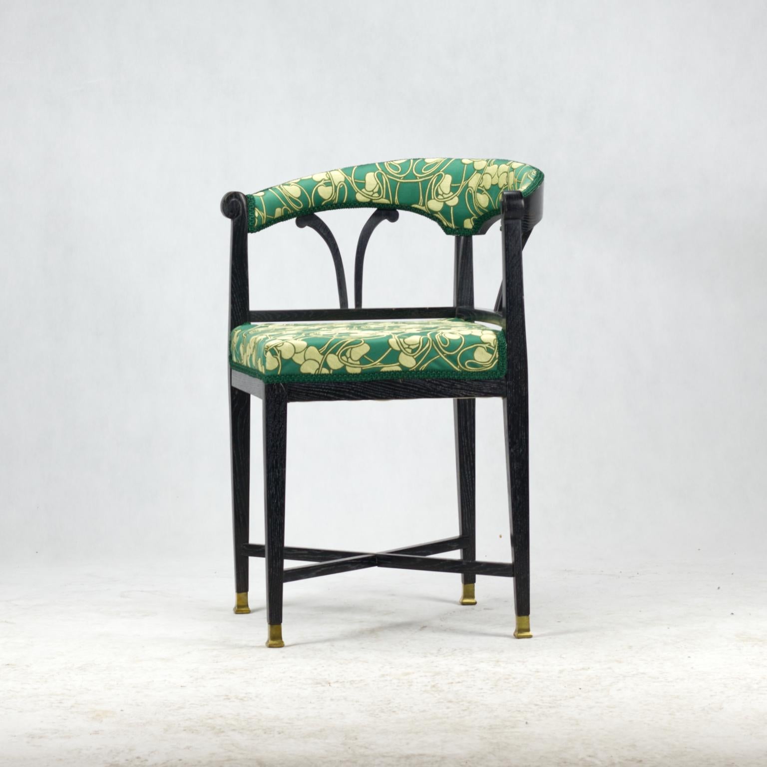Art Nouveau ebonized wood corner chair in new upholstery.