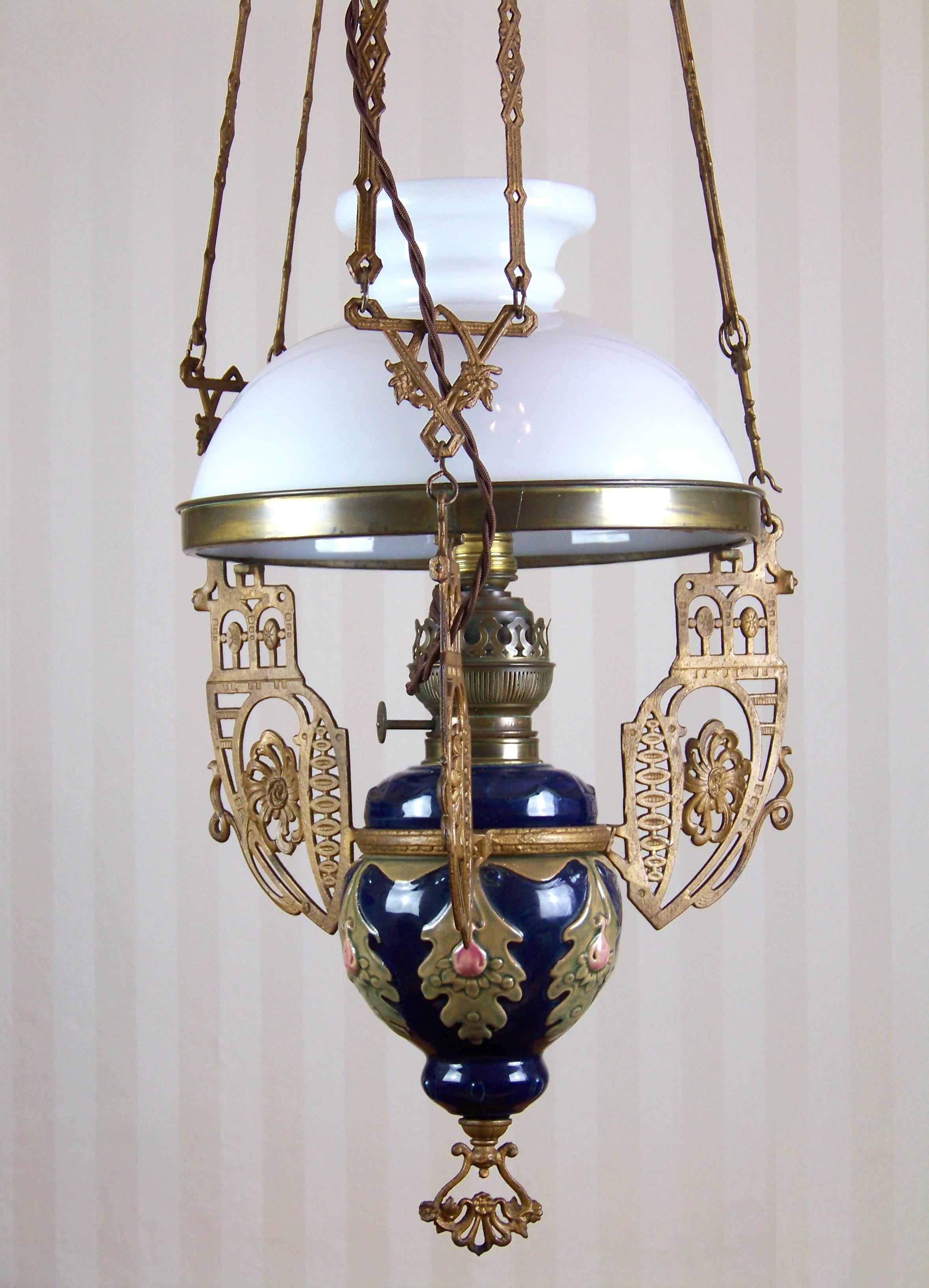 Measures: Height: 100 to 125cm (chandelier is retractable), diameter: 32cm. Originally a kerosene chandelier converted into electricity around year 1900. Perfectly cleaned, new cabling.