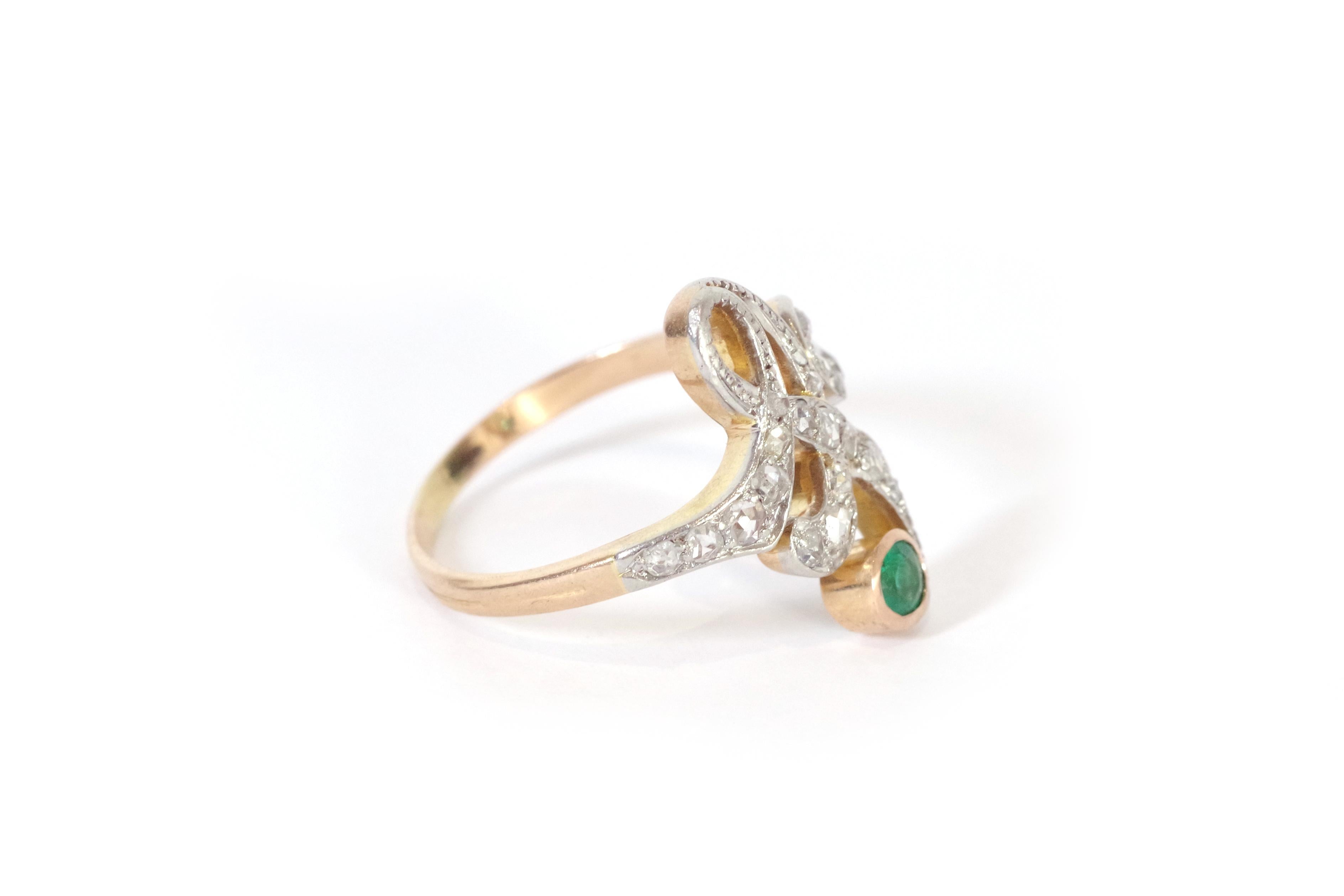 Art Nouveau emerald ring in 18 karat rose gold and platinum. Art Nouveau ring with sinuous lines in platinum, set with 21 rose-cut diamonds and ending with a round emerald in a closed setting. Antique Art Nouveau ring, circa 1910. 

Owl and mascaron