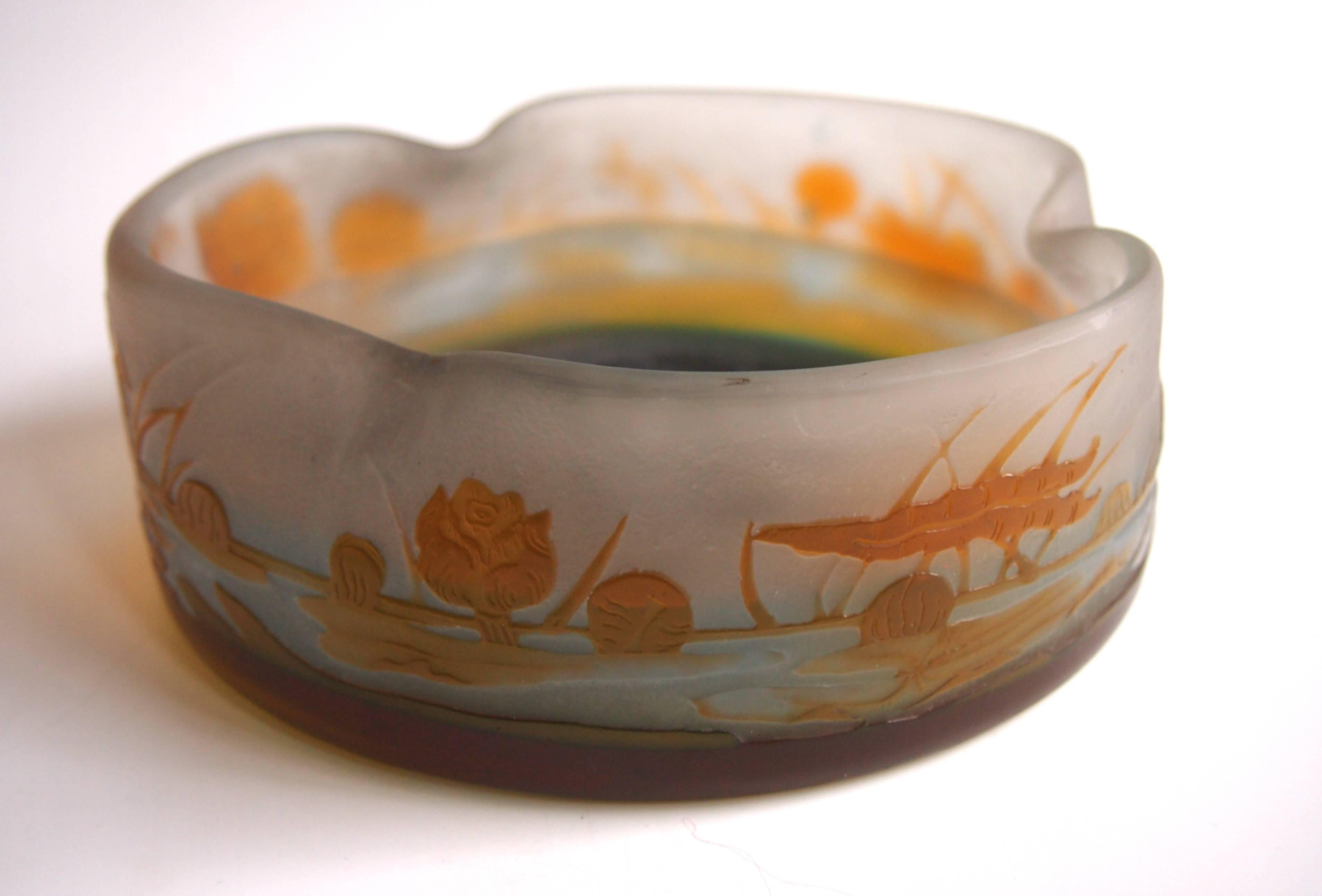 Super Art Nouveau Emile Galle cameo aquatic low bowl in orange over blue depicting a extensive pond scene with flowing water lilies, cameo signature with a star (image 4). The star indicates it was made just after Emile Galle's death -the signature