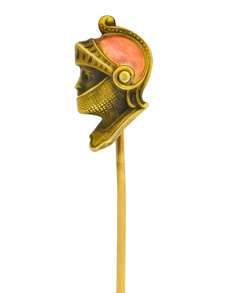 Featuring the profile of a man in a knight's helmet

Red enamel accented helmet

Highly detailed with intricate gold work

Tested as 14 karat gold

Knight Measures: 5/8 x 3/83/8 Inch

Total Length: Approx. 2 1/2 Inches

Total Weight: 1.2