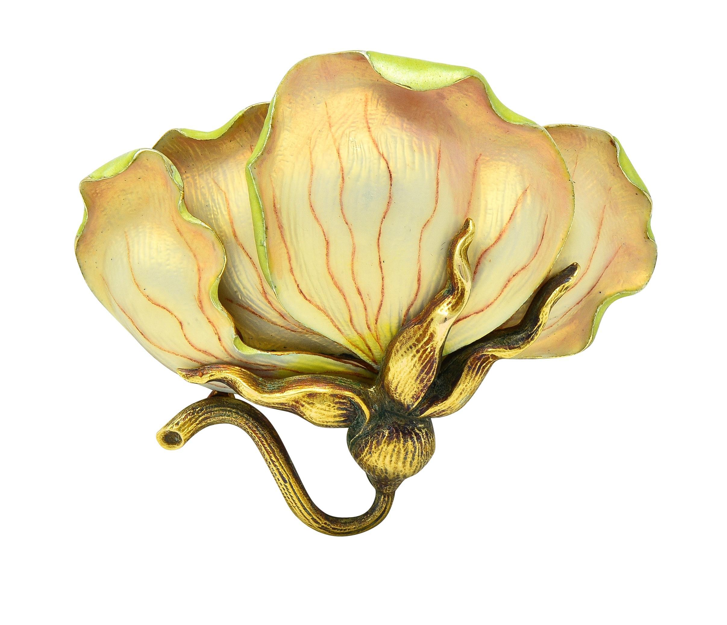 Designed as a dimensional plucked flower in profile with curling petals and winding stem
Petals are painted with basse-taille enamel over linear engraving 
Matte iridescent yellow and pink with red veining - minimal loss
Foliage and stem are