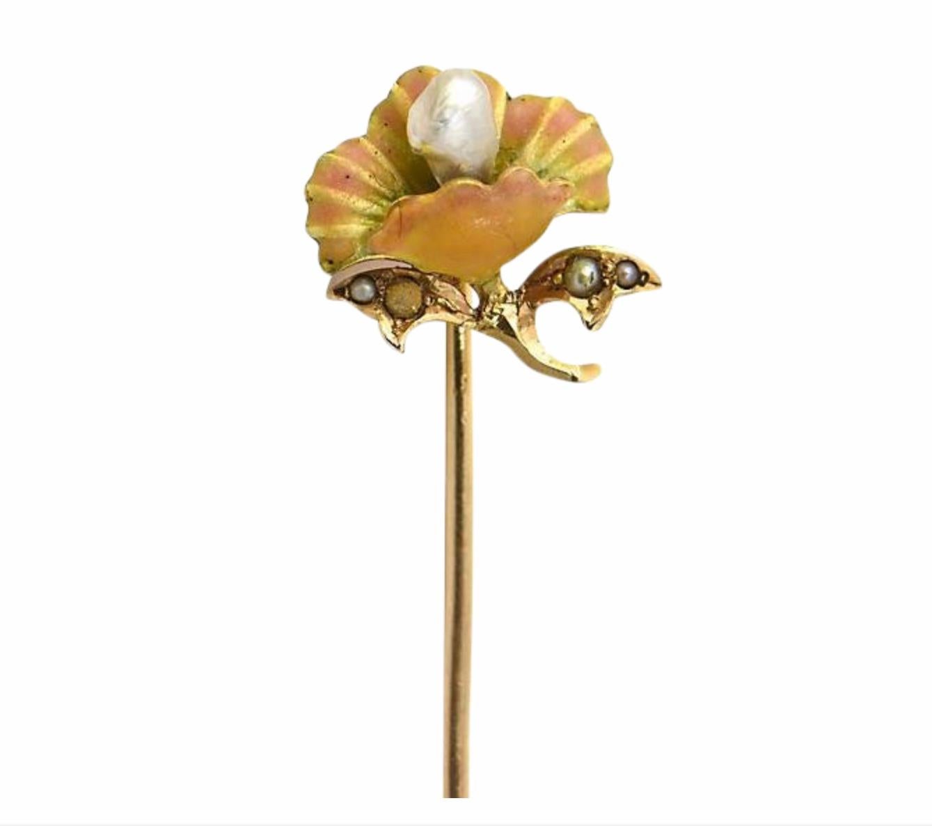 Art Nouveau floral 14K yellow gold stick pin featuring a natural pearl popping out of an enamel flower. Four tiny pearls are set in the two leaves. No maker's mark. One of the tiny pearls is missing its nacre (not easily visible without