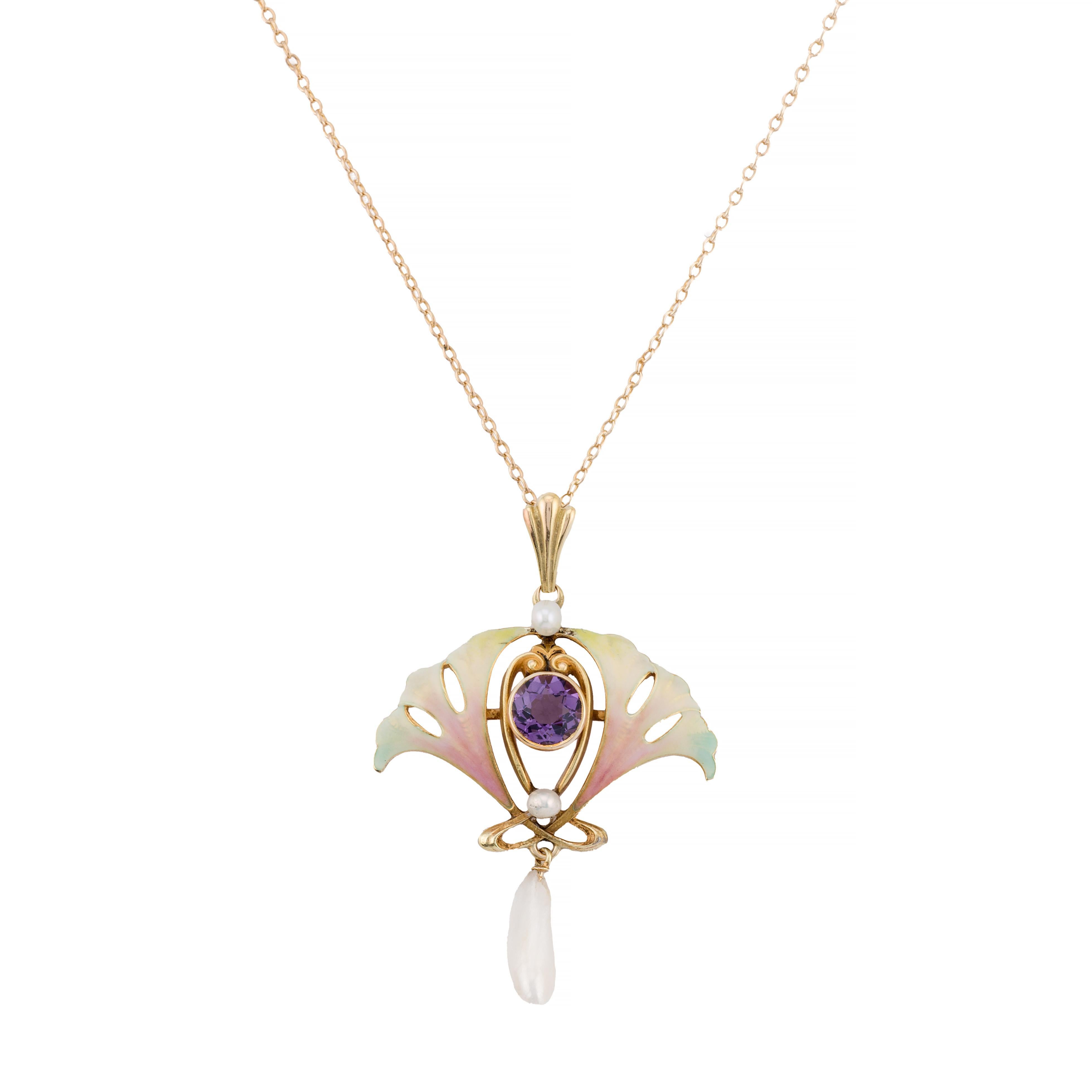 Aston Estate Jewelry presents:

An exquisite Art Nouveau bib necklace by Henry Blank & Sons. The design features a central European-cut amethyst, weighing 2.5 carats, in a vibrant purple hue. Flanking the amethyst are delicate enamel Ginko leaves in