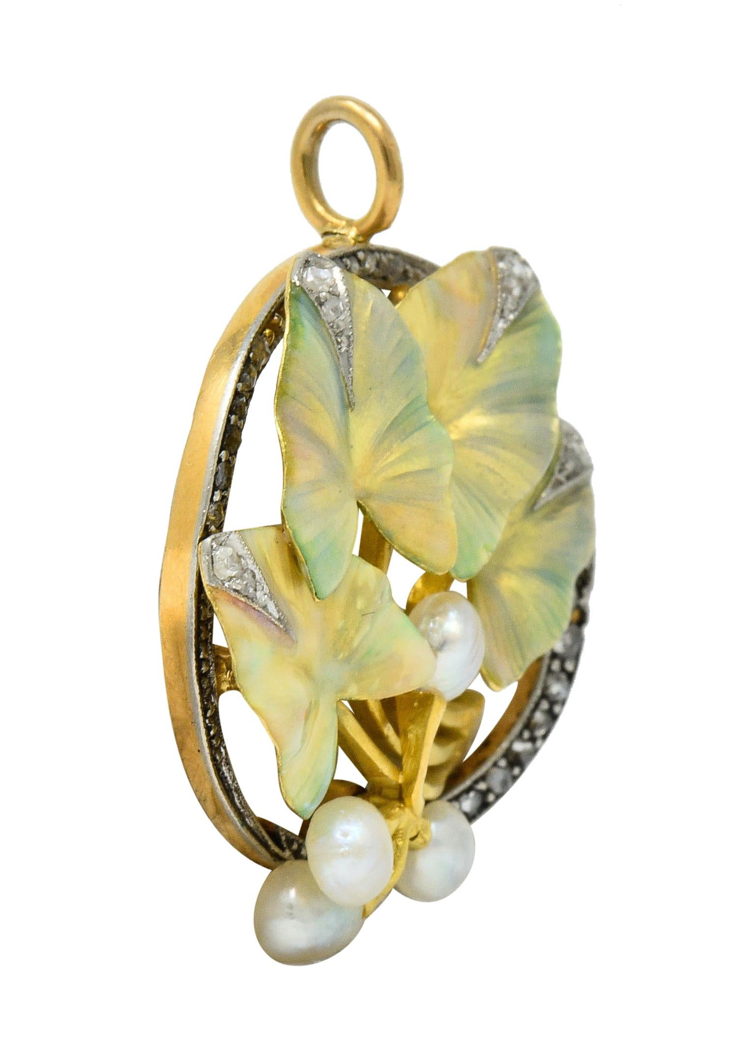 Circular platinum-topped yellow gold brooch centers flourishing green gold ivy leaves

Glossed with pastel and iridescent enamel; exhibiting no loss

With a bushel of 4.0 mm semi-round pearls, well-matched with white body color and strong