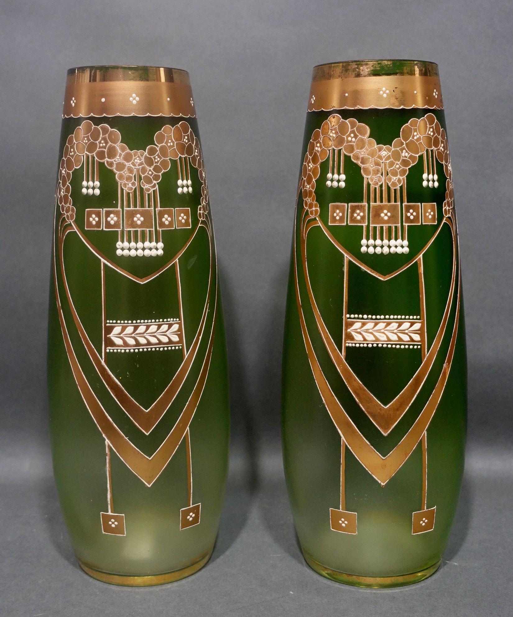 A Pair of Green Glass vases of Art Nouveau style with Enameled and Gilt Art Glass Vases formed very elegant shapes with subtle curved lines.
