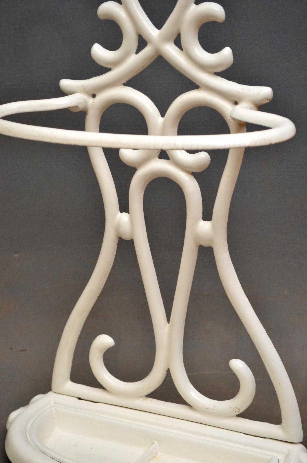 K088 stylish French, Art Nouveau cast iron umbrella stand of organic design, having original drip tray and retaining white enamel throughout, all in wonderful condition throughout - ready to place at home, circa 1910
Measures: H 29