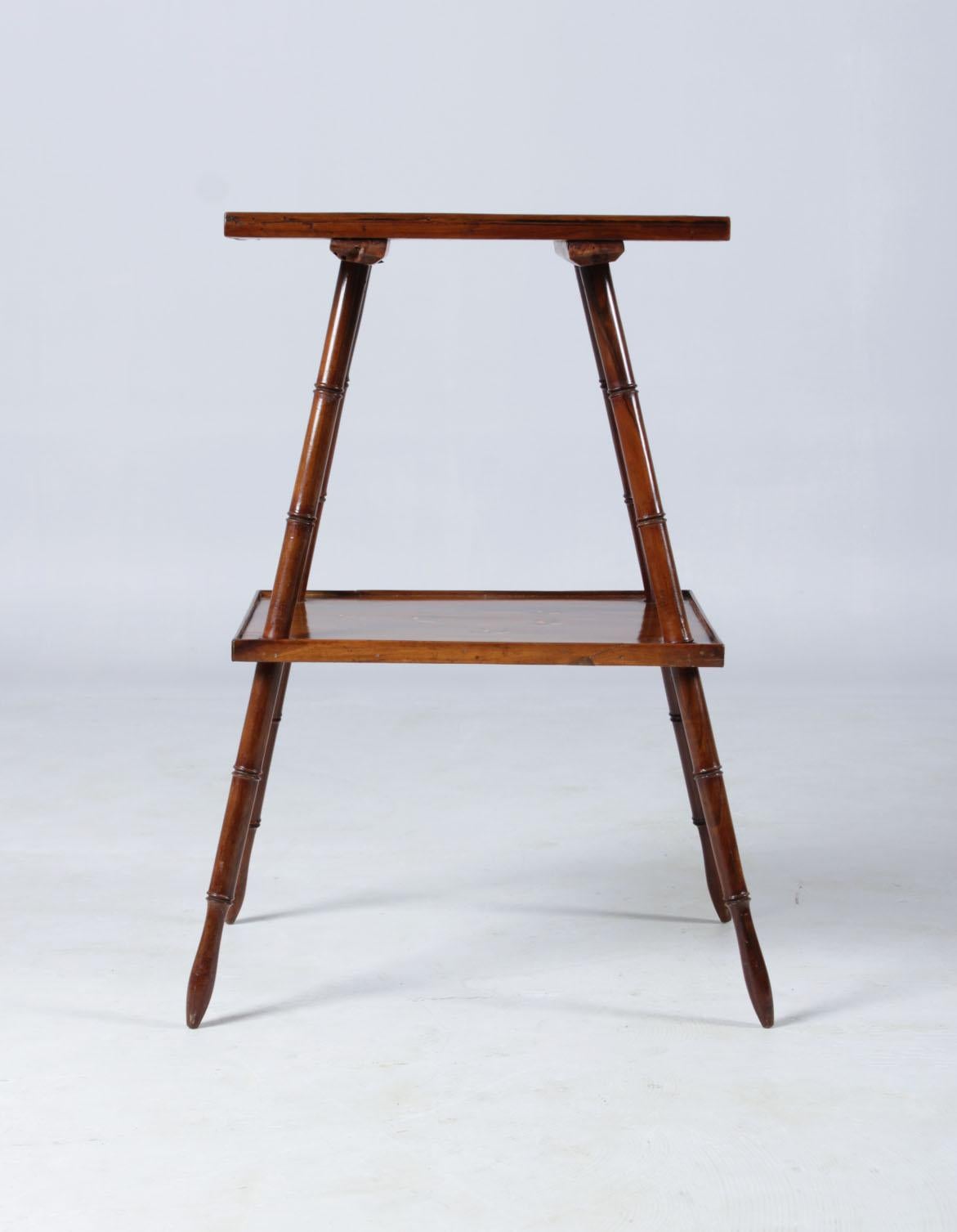 Fine antique etagere

France (?)
Fruitwood
Art Nouveau around 1910

Dimensions: H x W x D: 69 x 42 x 31 cm

Description:
Dainty side table with two shelves.
Strongly slanted legs, turned and reminiscent of bamboo wood.

The lower plate