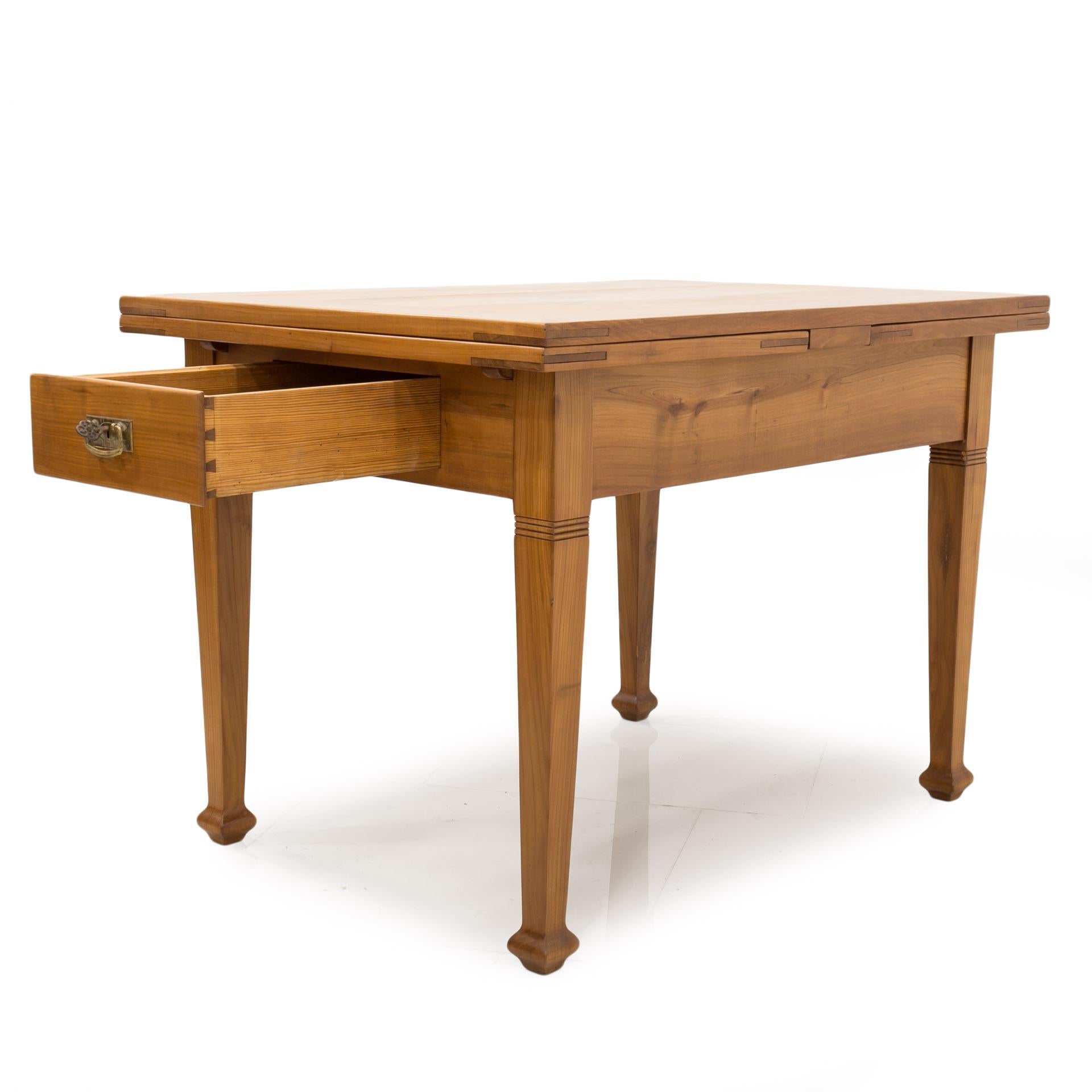 This beautiful table in Art Nouveau style comes from Germany from the beginning of 20th century. It is made of cherrywood and its surface has been gently refreshed and refinished with natural wax-oil that protects and cares for the wood. It features