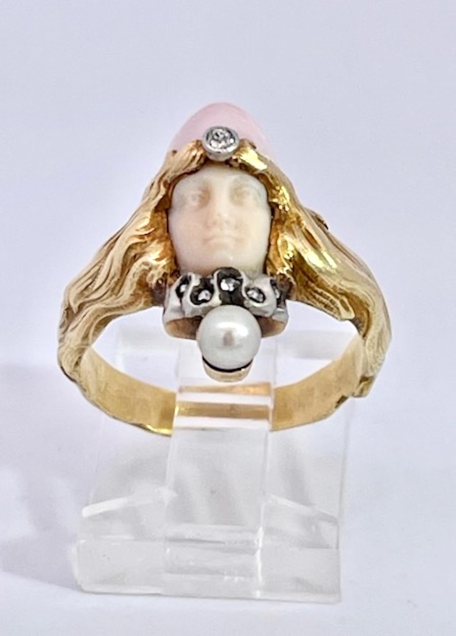 This piece is extremely rare as it is a Ladies Head, Face and Flowing hair ring. This was done by a master in the Art Nouveau period.  It is not signed and RB in script is all that is marked but this piece is exquisite. The face of the lady is done