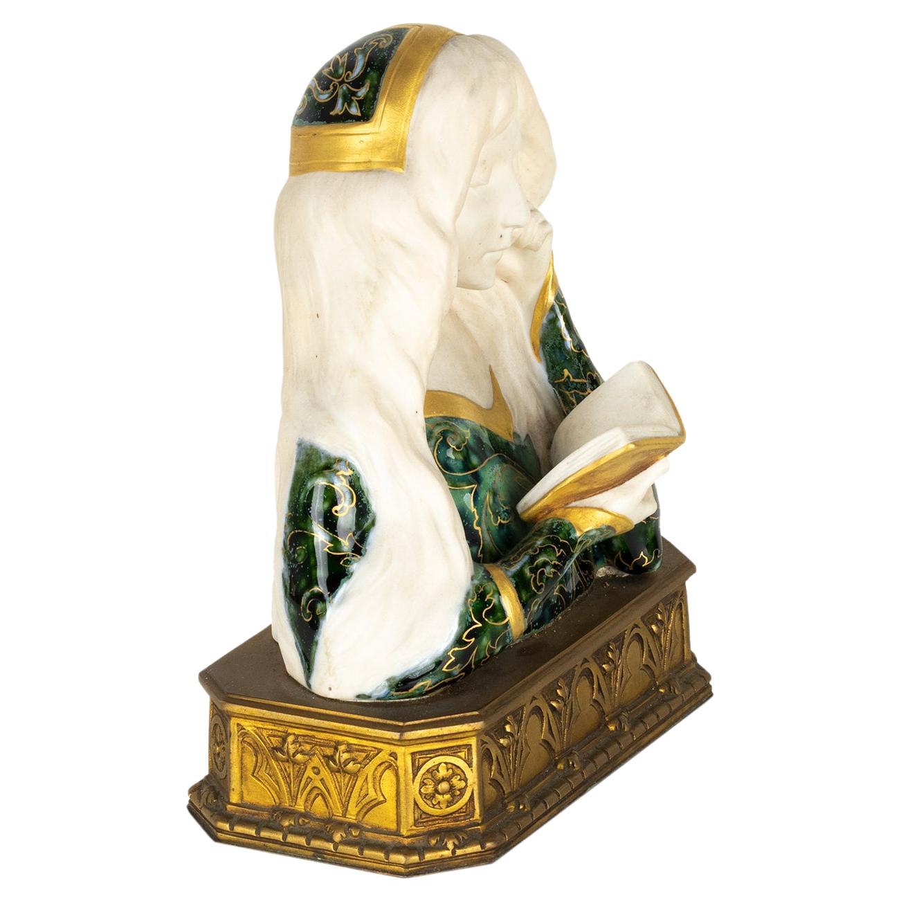 Un busto in ceramica e bronzo dorato.
Ceramica Delagrange e bronzo della fonderia Louchet Ciseleur, Parigi. 
Il busto è una fanciulla montata su una base rettangolare in bronzo dorato, con l'iscrizione DELAGRANGE e il marchio Louchet.

Leon Noel