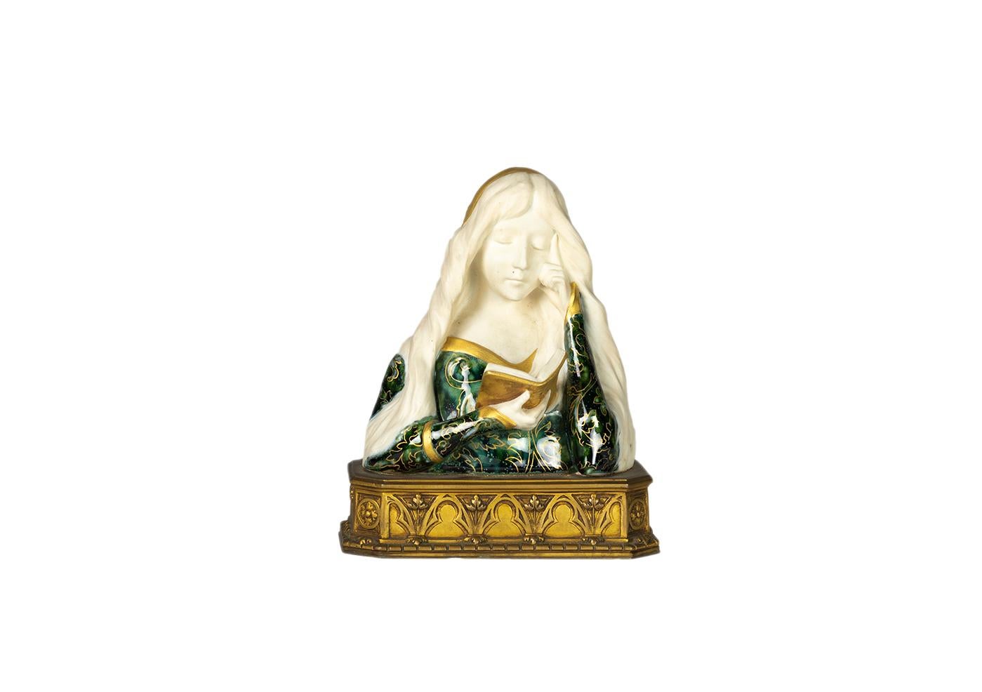 An Art Nouveau ceramic and gilded bronze feminine bust by Leon Noel Delagrange.

Delagrange ceramic and bronze by the foundry Louchet Ciseleur, Paris. 

The bust is a maiden mounted on a rectangular base in gilded bronze, with the inscription