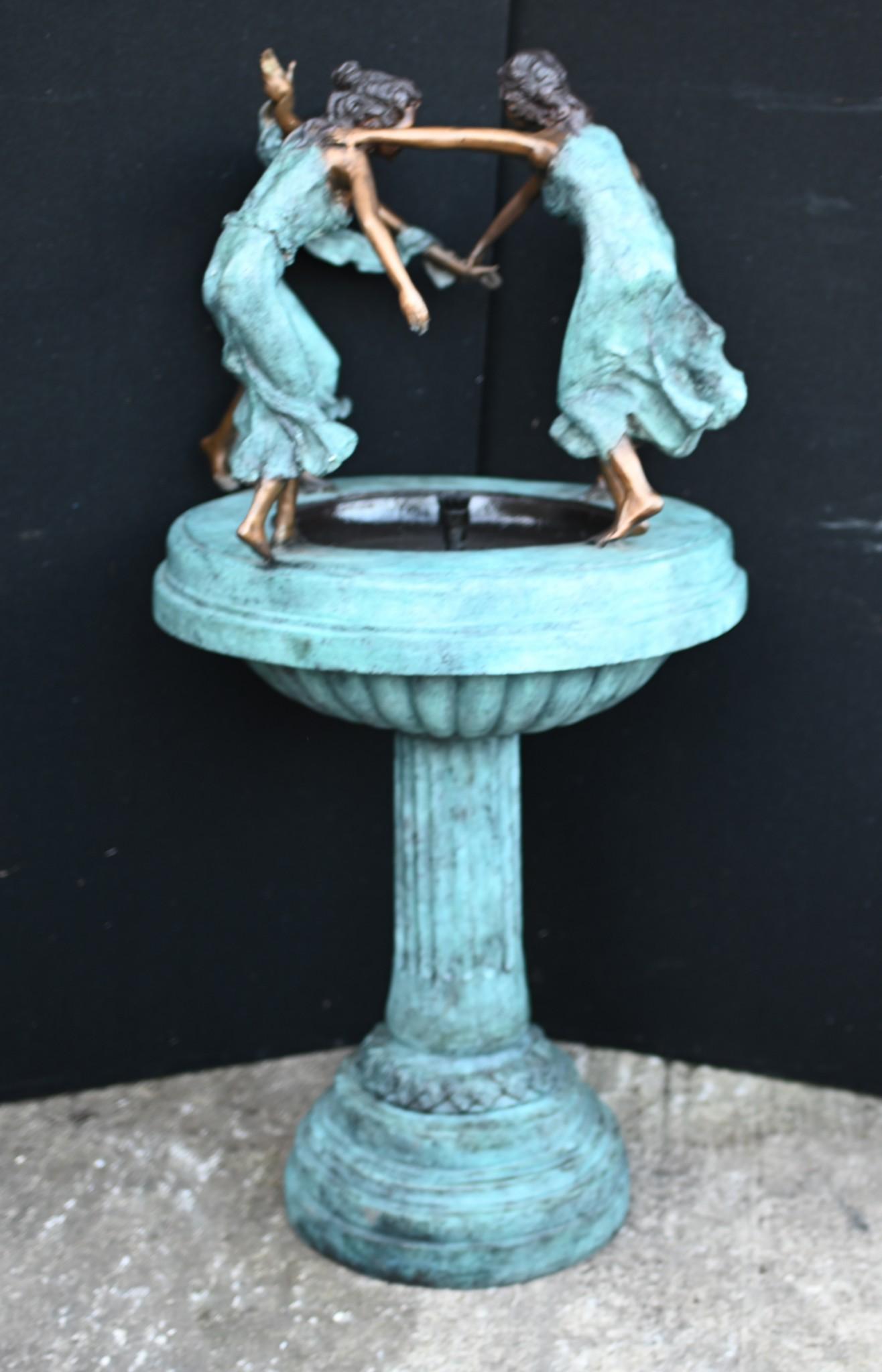 Delightful bronze garden water fountain 
In the Art Nouveau manner, the fountain features a quartet of faireys
Frolicking maidens are depicted dancing around the rim of the fountain
Such a charming piece, would bring any garden alive
Great work