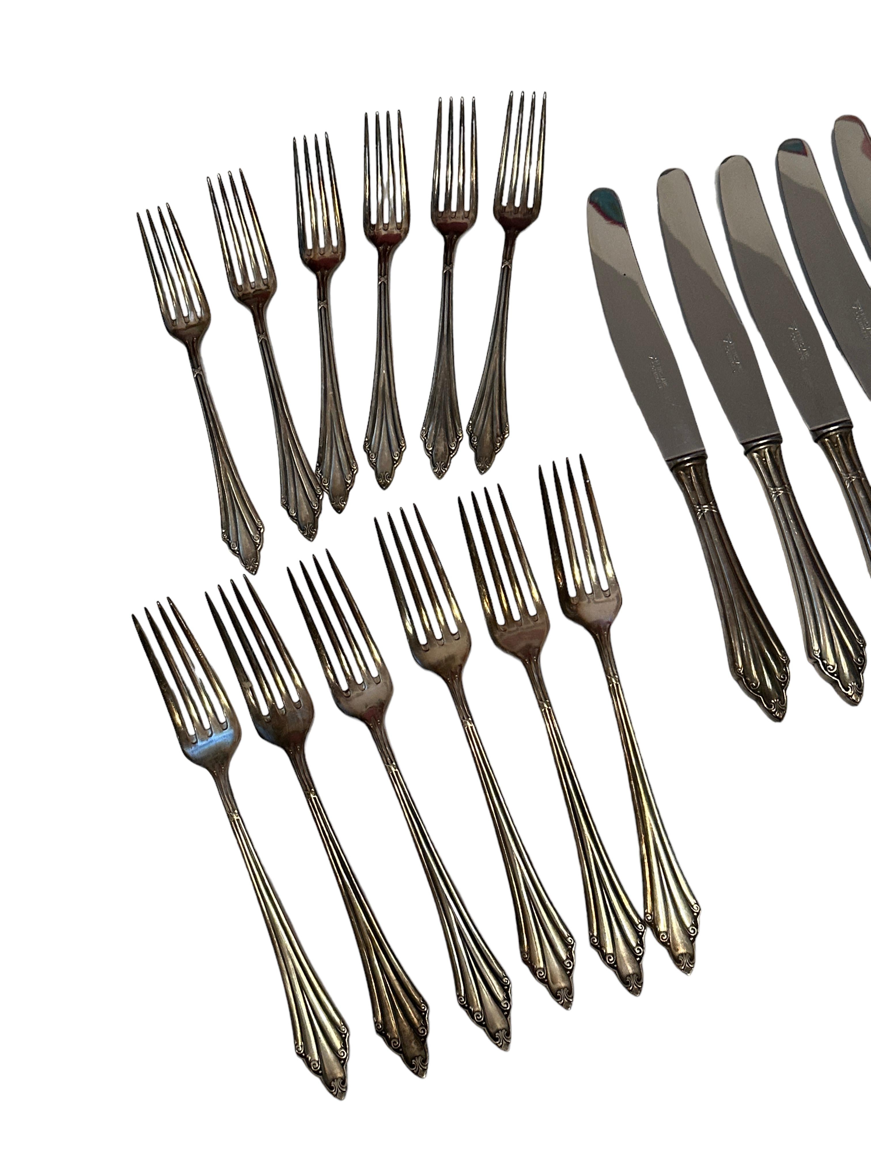 A beautiful Art Nouveau flatware set of 12 cake forks, 6 Coffee Spoons, 6 Soup spoon, 6 large knife and 6 smaller ones. also 6 large forks and 6 smaller ones. A total of 48 pieces, made by WMF in the Fan design. Made of silver plate metal, it will