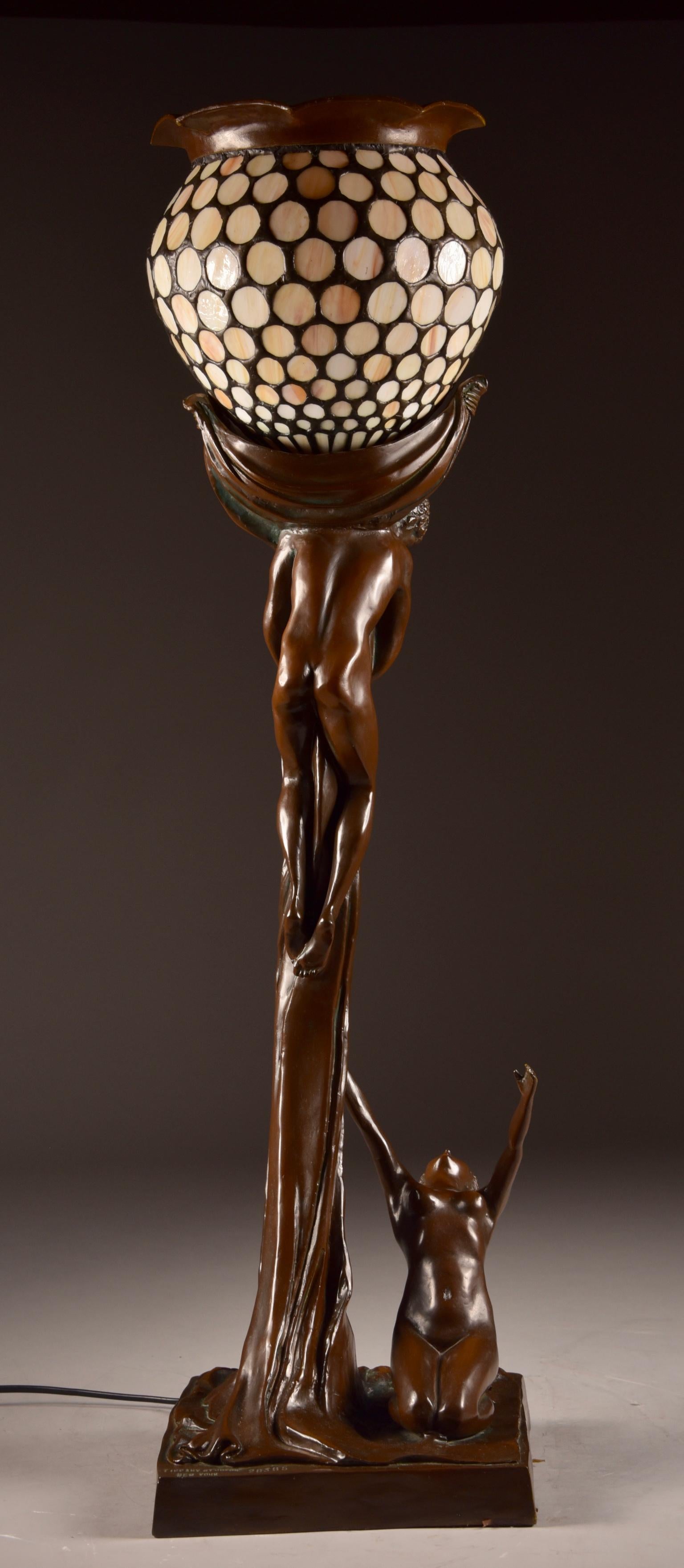 Very nice rare large Art Nouveau floor lamp. Image of a romantic embrace naked man and woman. Reproduction Tiffany.
 
