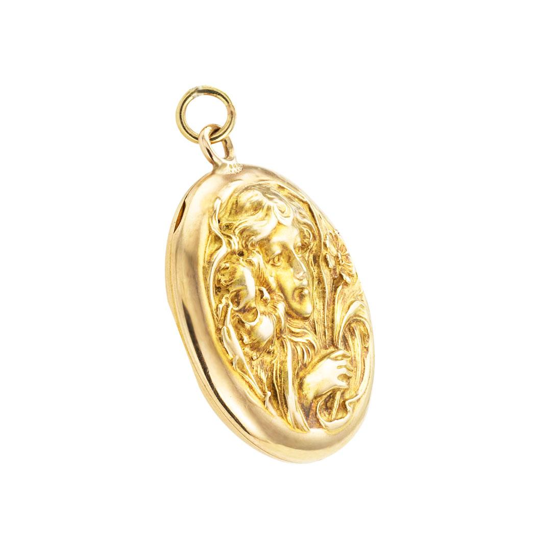 Art Nouveau figural yellow gold locket circa 1905. *

ABOUT THIS ITEM:  #P-DJ612i. Scroll down for detailed specifications.  Art Nouveau lockets are characterized by the era’s fascination with nature and organic forms.  This is a beautiful example