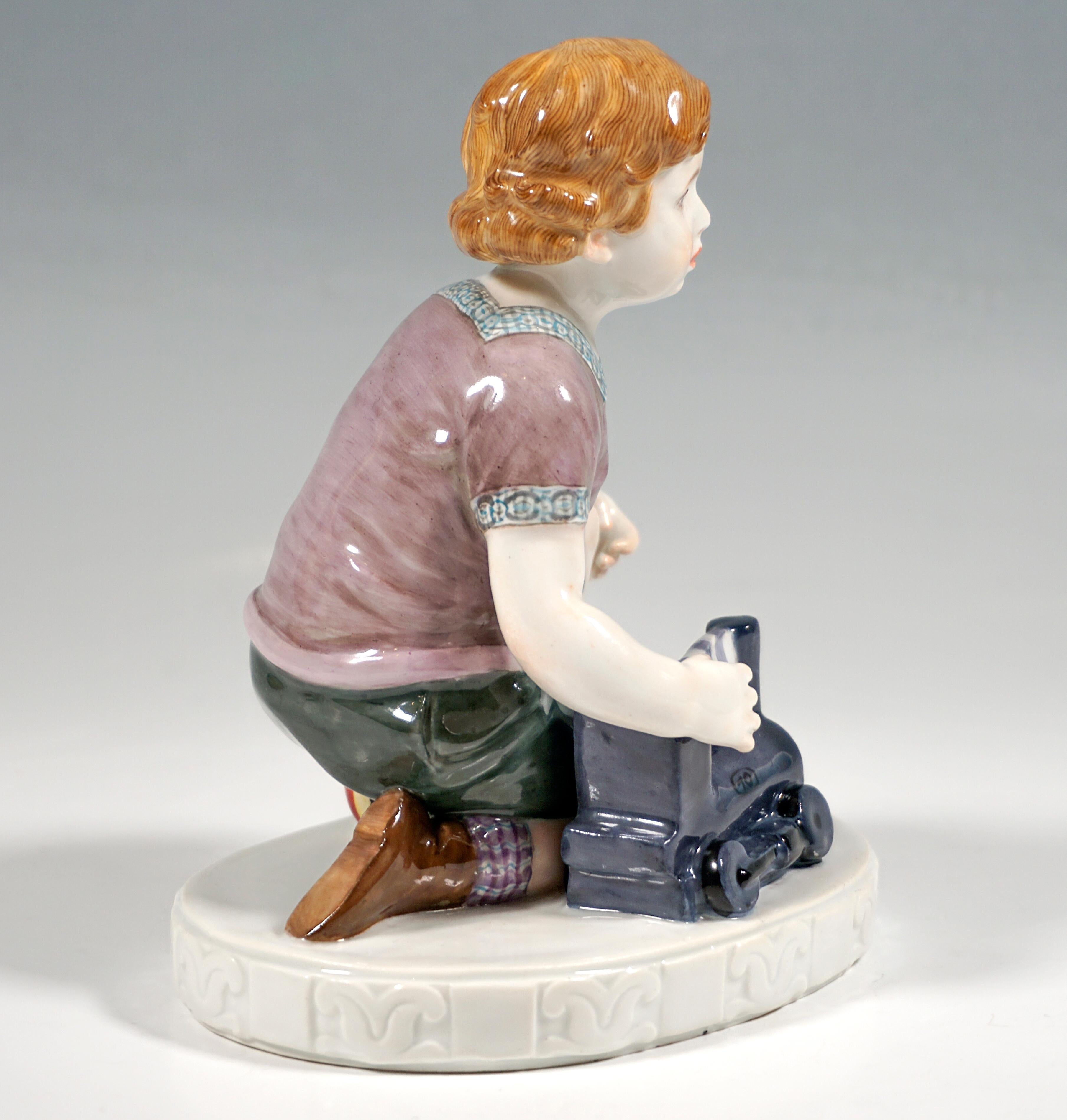Very rare Meissen porcelain figure:
Boy with curly hair, wearing a short shirt with a square neckline and patterned hems, breeches and high brown shoes with checkered socks, kneeling with his right knee on the ground and reaching for the toy