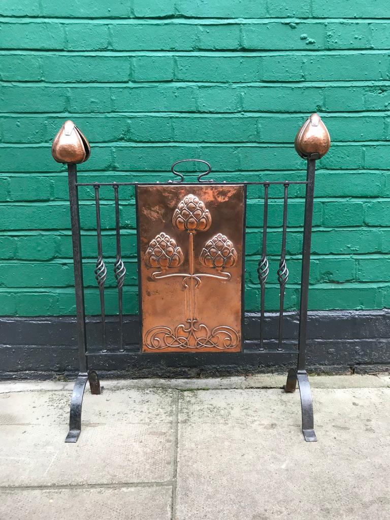 Original Art Nouveau stainless steel and copper fire screen, with copper tulip heads and copper flowered frieze.
