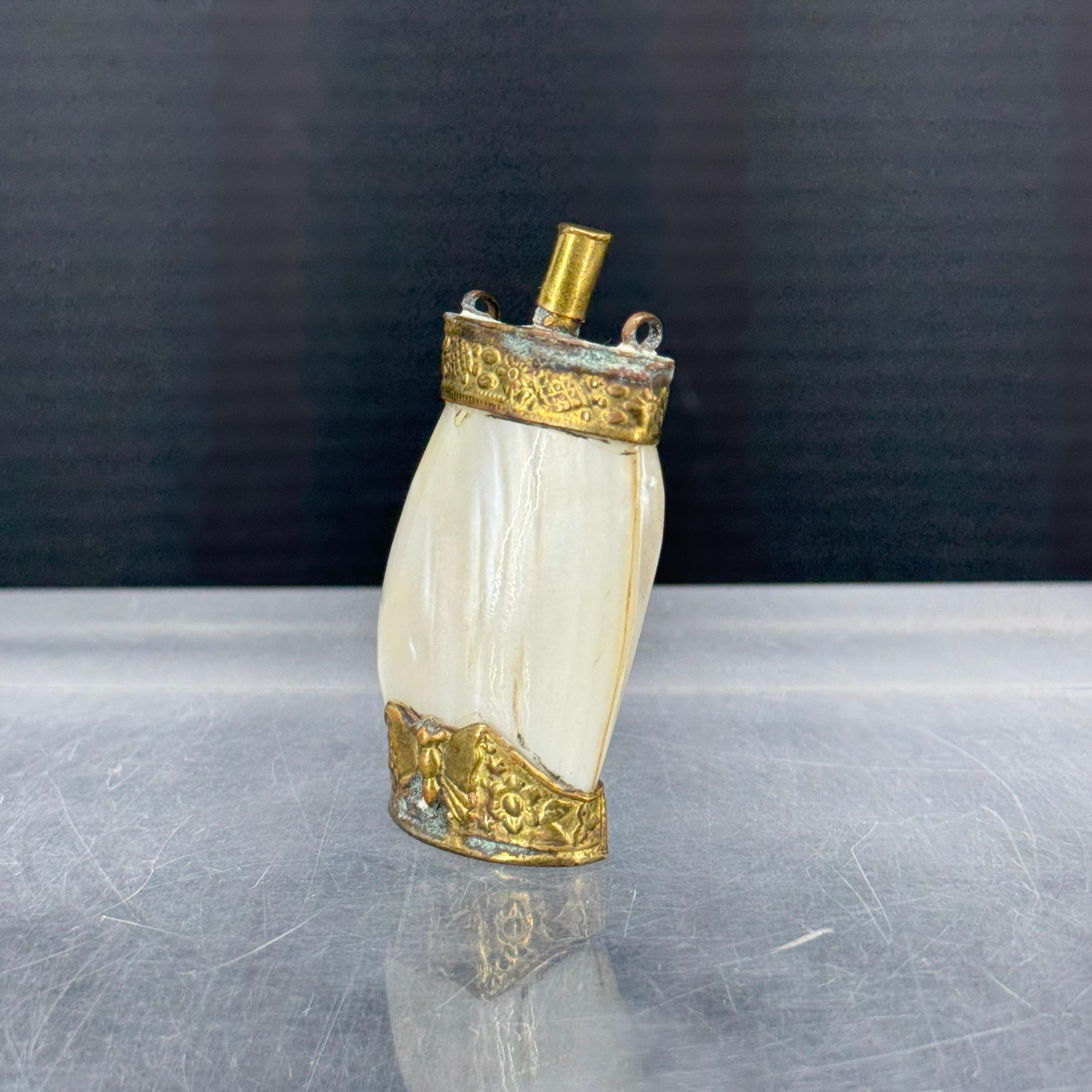 Charming Mother of Pearl chatelaine perfume scent or snuff bottle. Very intricate details including a butterfly on the base. Wonderful piece to add to a collection of these desirable vintage pendants or bottles. 