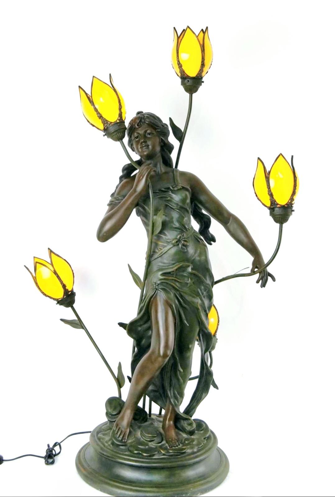 Rare sculptural tulip slag glass floor lamp with stunning female bronze statue.
50