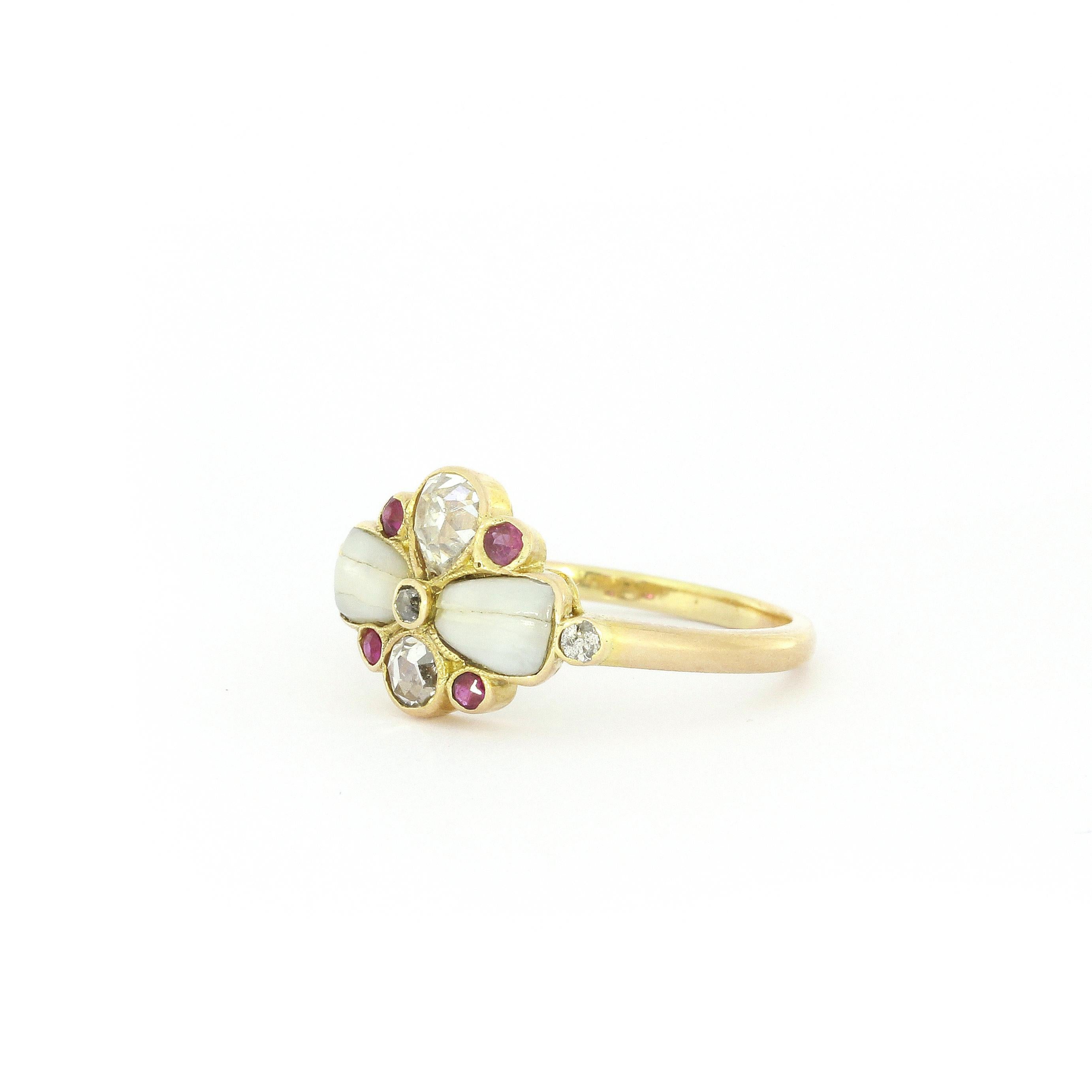 Art Nouveau Floral Diamond Ruby Ring In Yellow Gold
5 Diamonds ca. 0,52ct + four little rubies + two possible opal stones

Measurements
L: 11mm
W: 17mm
H: 5mm