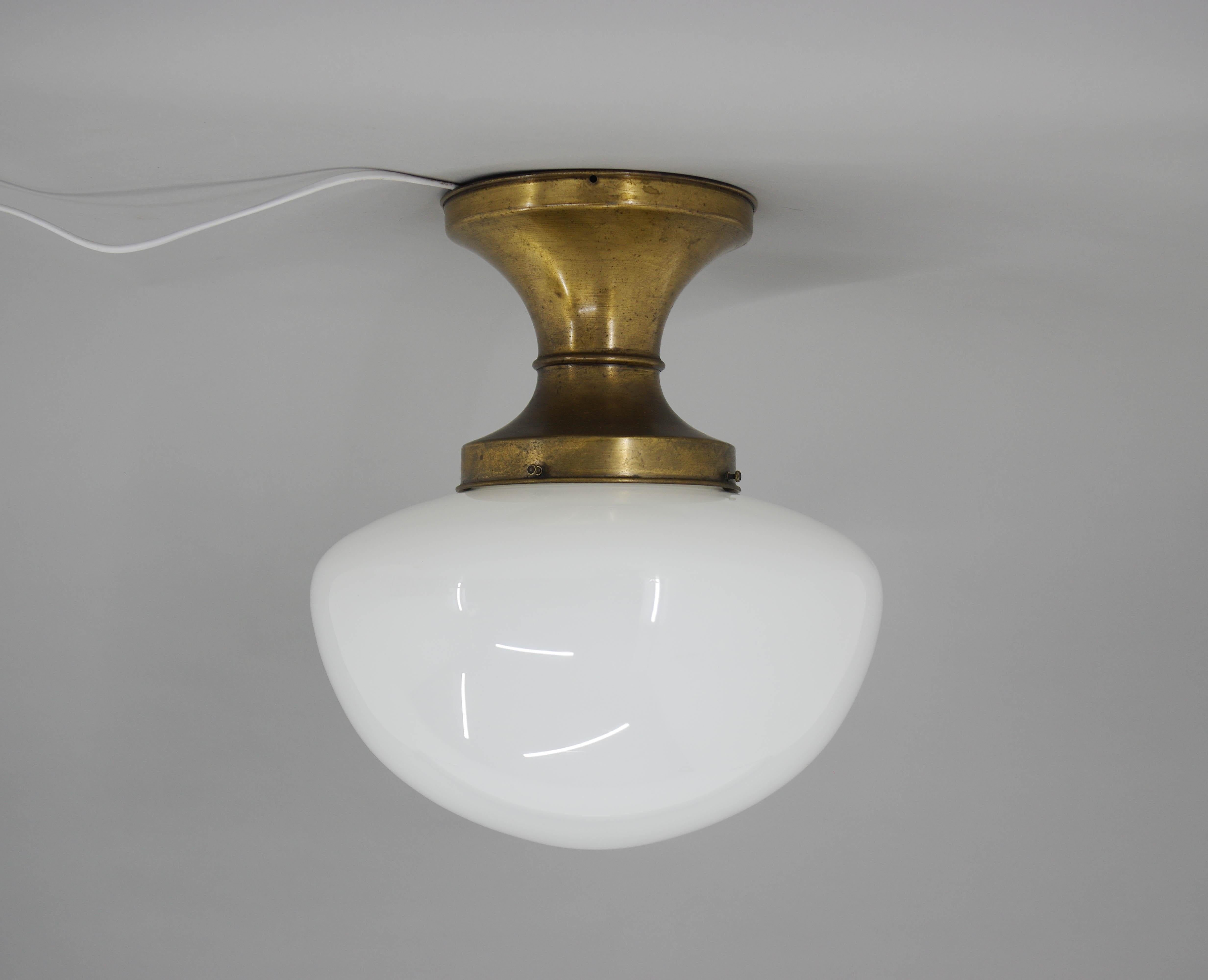 Big Art Nouveau flush mount made of lacquered brass and opaline glass.
Brass with nice age patina.
Glass in perfect condition.
Rewired: 1x60W, E25-E27 bulb
US wiring compatible