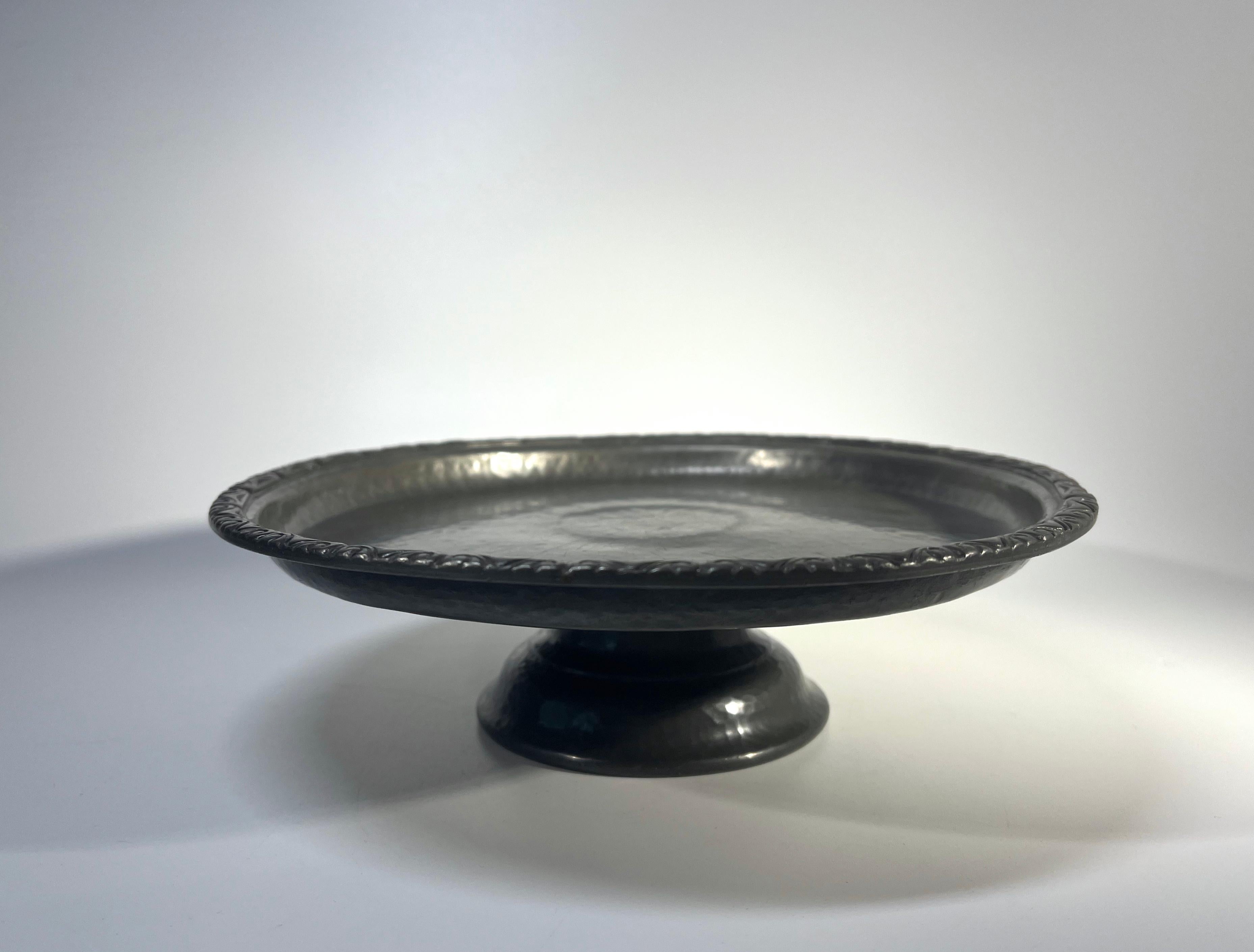 Art Nouveau antique pewter footed tray made by Liberty & Co., Regent Street, London
Historic household piece of English pewter with hand hammered stylised decoration
Circa 1910
Signed English Pewter, Made By Liberty & Co 01371 to base
Height 2.25