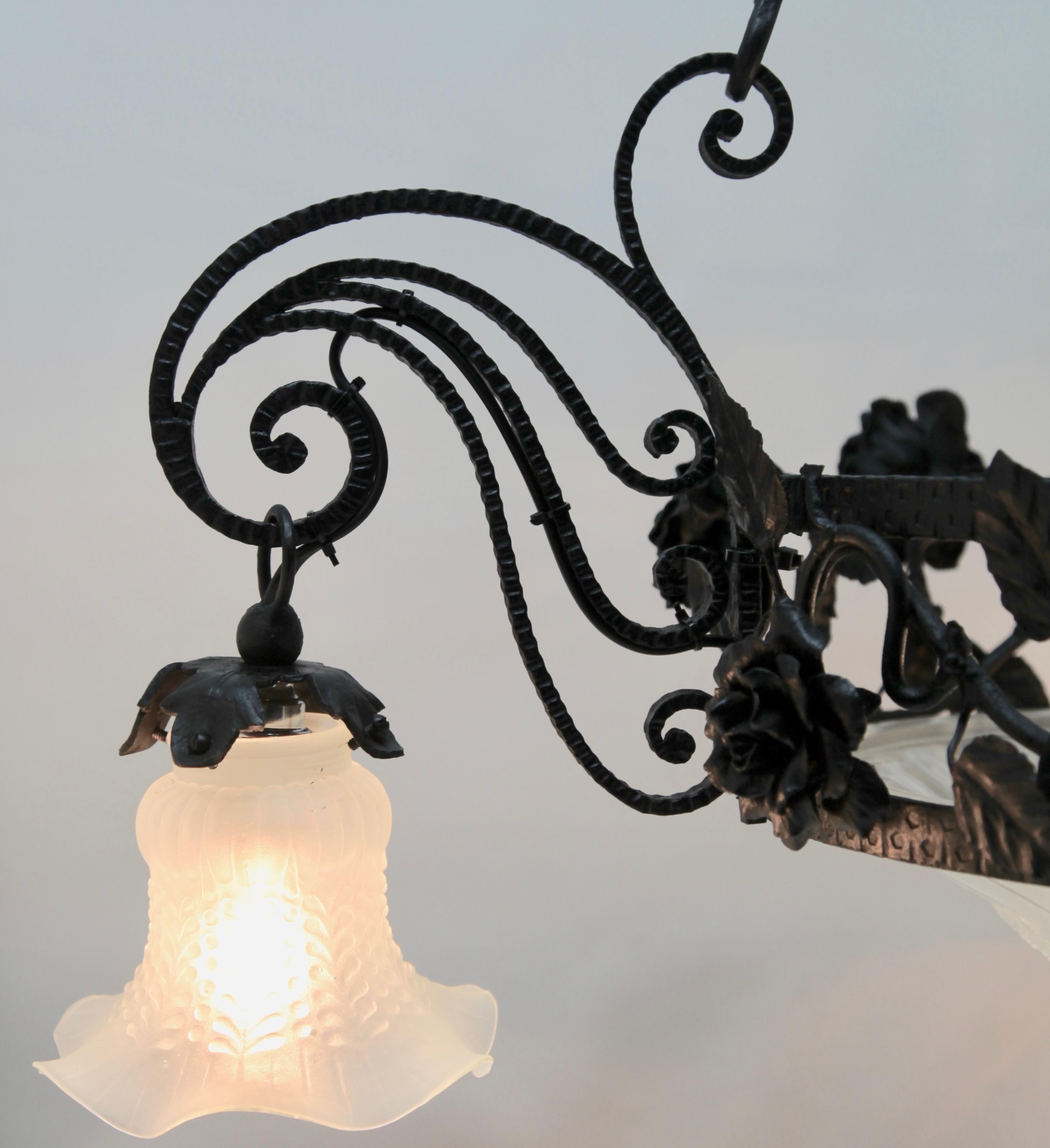 Art Nouveau forget metal floral decor chandelier Luneville, 1900s.

Photography fails to capture the simple elegant illumination provided by this lamp.

In excellent condition and in full working order having recently been re-wired and provided with