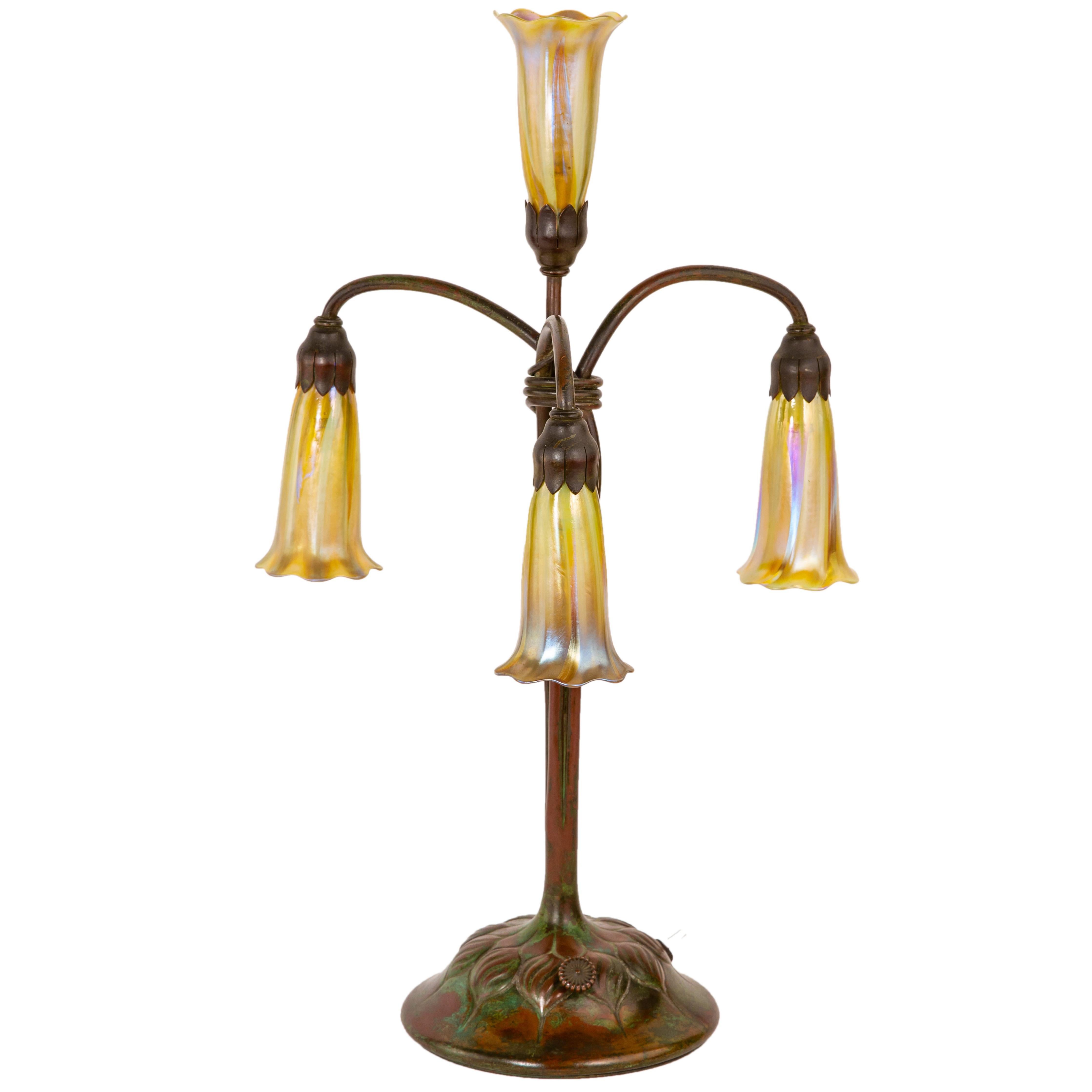 An American Art Nouveau Four-Light Lily Table Lamp by, Tiffany Studios 