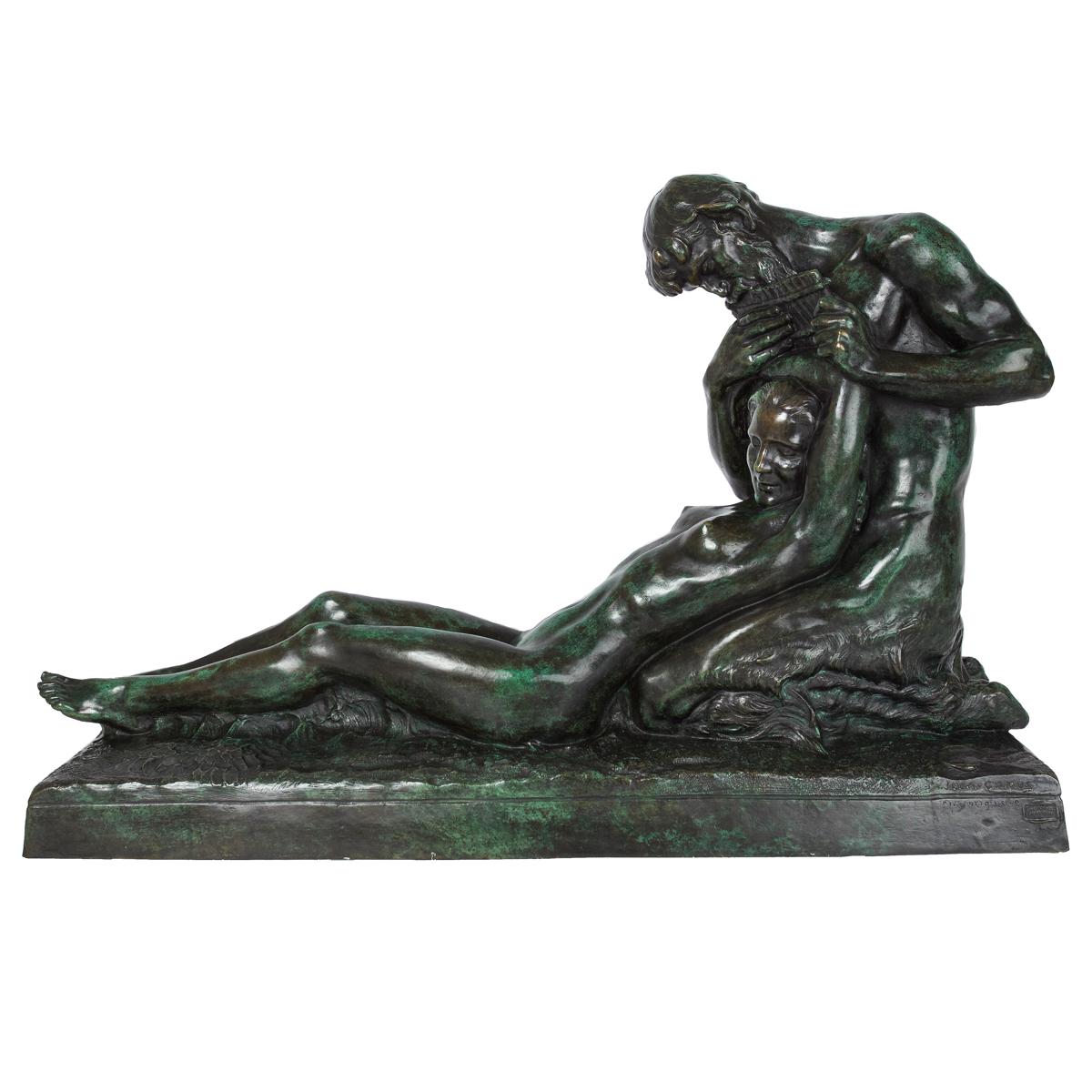 A rich Art Nouveau model of kneeling Pan playing his siku for the young nymphe deep in sleep upon his lap, her legs and body comfortably resting on a bed of soft grass. The model is finished in an exquisite verde and black surface patina with a