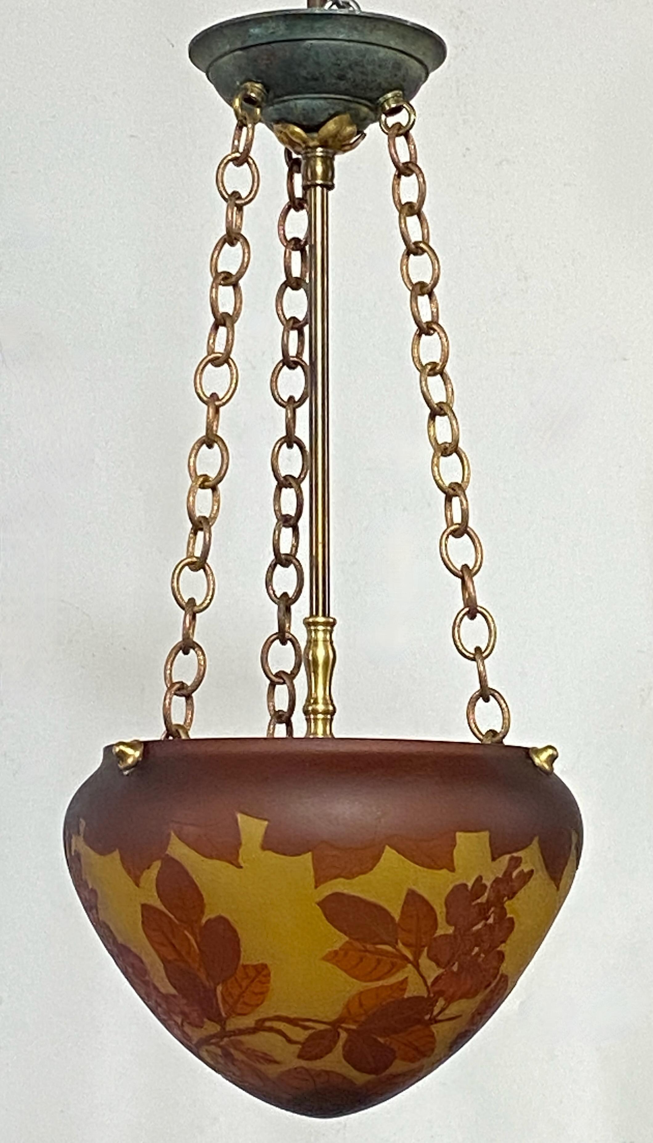 An exceptional French Art Nouveau period cameo glass pendant shape light fixture.
Braided copper chain with brass stem and canopy. 
Rewired for American standard and ready to install.
These photos do not do this light justice, shown with a too