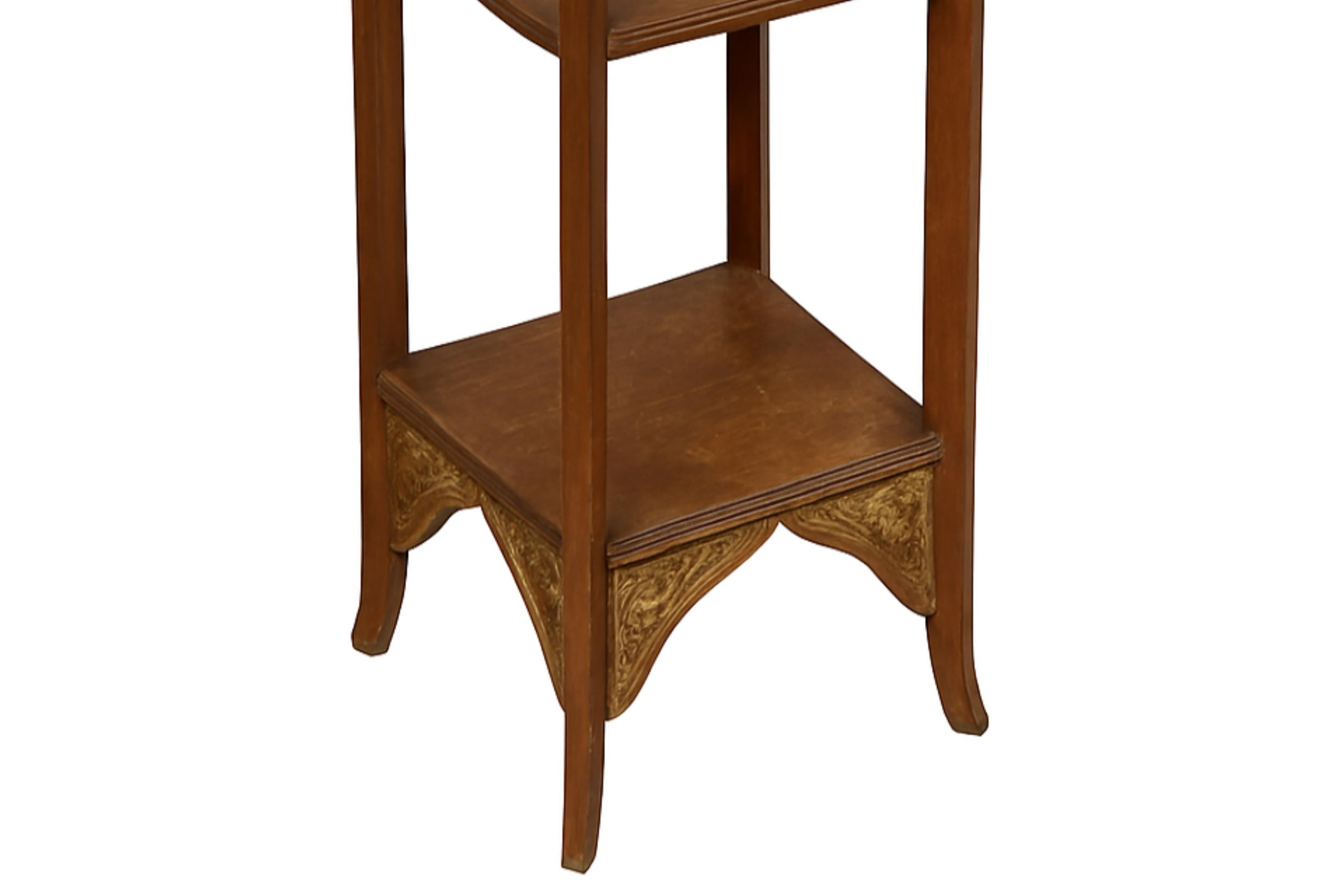A masterful expression of early 20th-century French craftsmanship, this chestnut pedestal embodies the flowing elegance of the Art Nouveau movement. Its sculptural silhouette and warm patina make it an ideal base for fine sculpture or floral