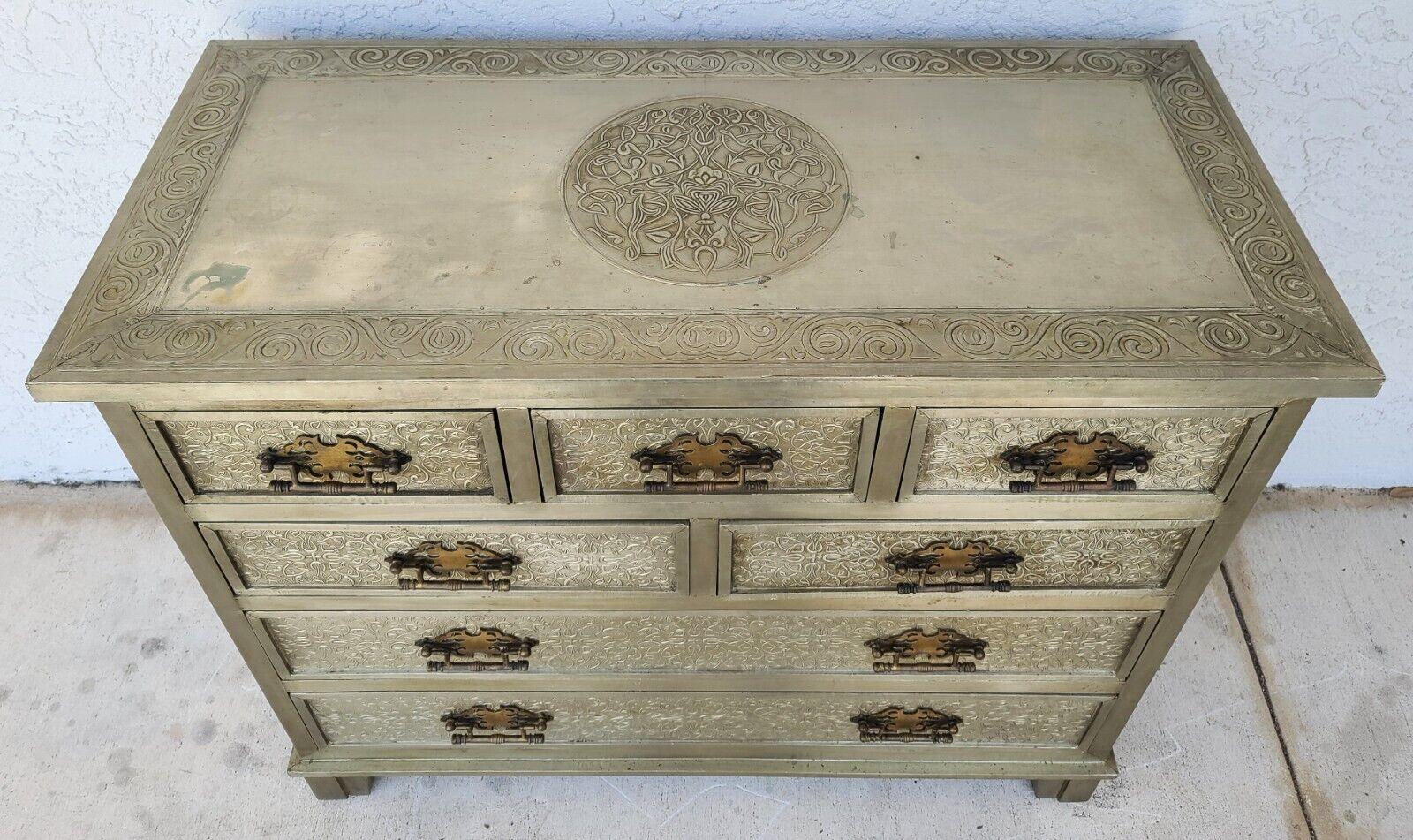 Offering One Of Our Recent Palm Beach Estate Fine Furniture Acquisitions Of An Art Nouveau French style Decorative Embossed Metal Dresser or Commode
It is solid wood wrapped in decorative metal.

Approximate Measurements in Inches
35